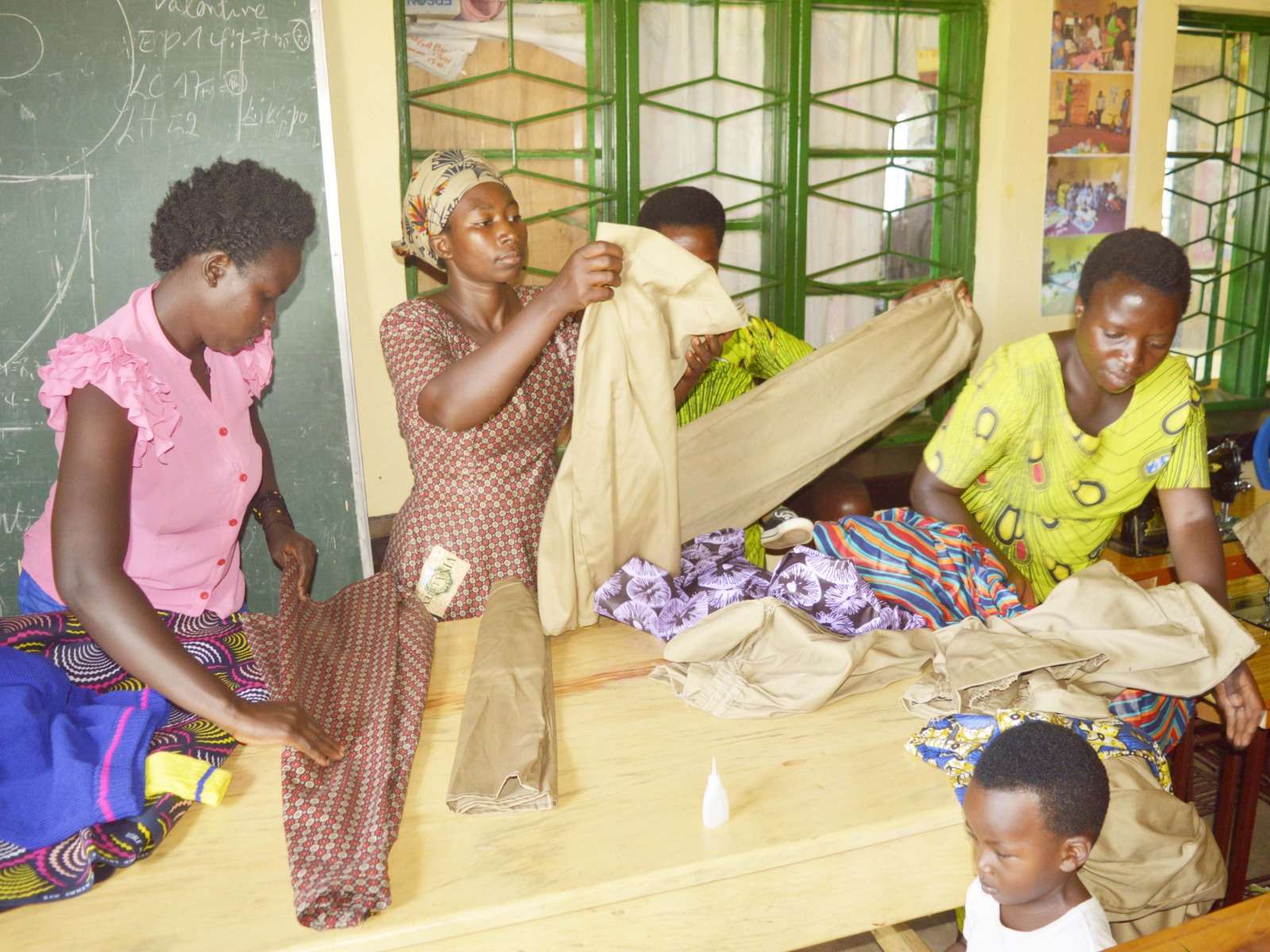 This photo shows tailors folding clothes