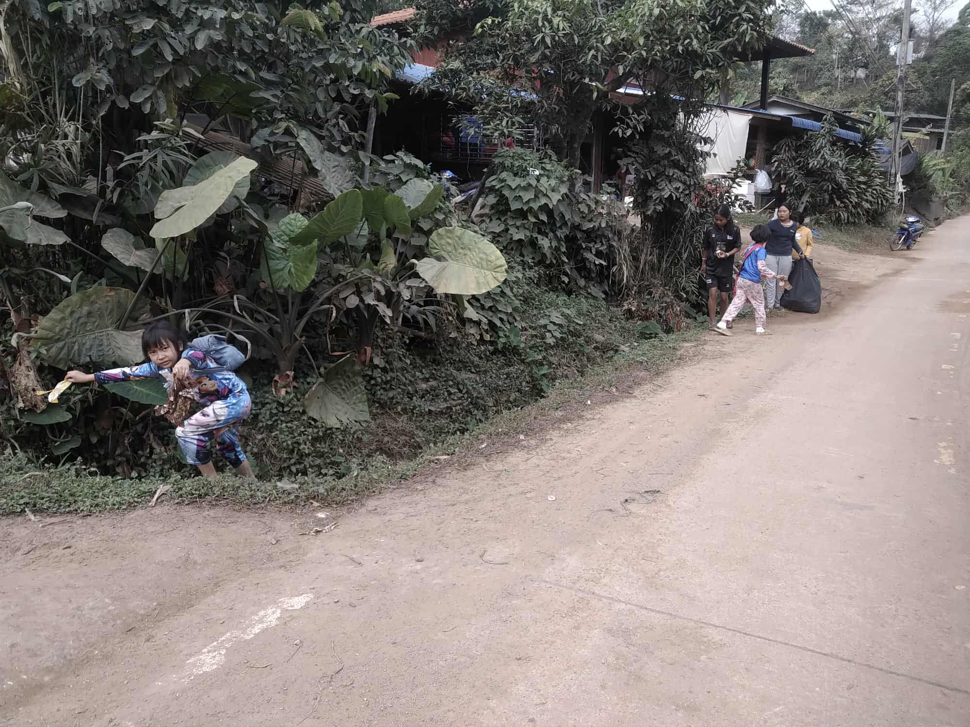 Children collect garbage on the streets in the community