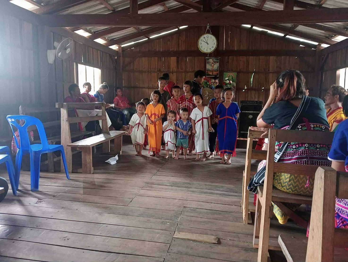 Children charming the congregation with a special song to raise funds for the solar cell system