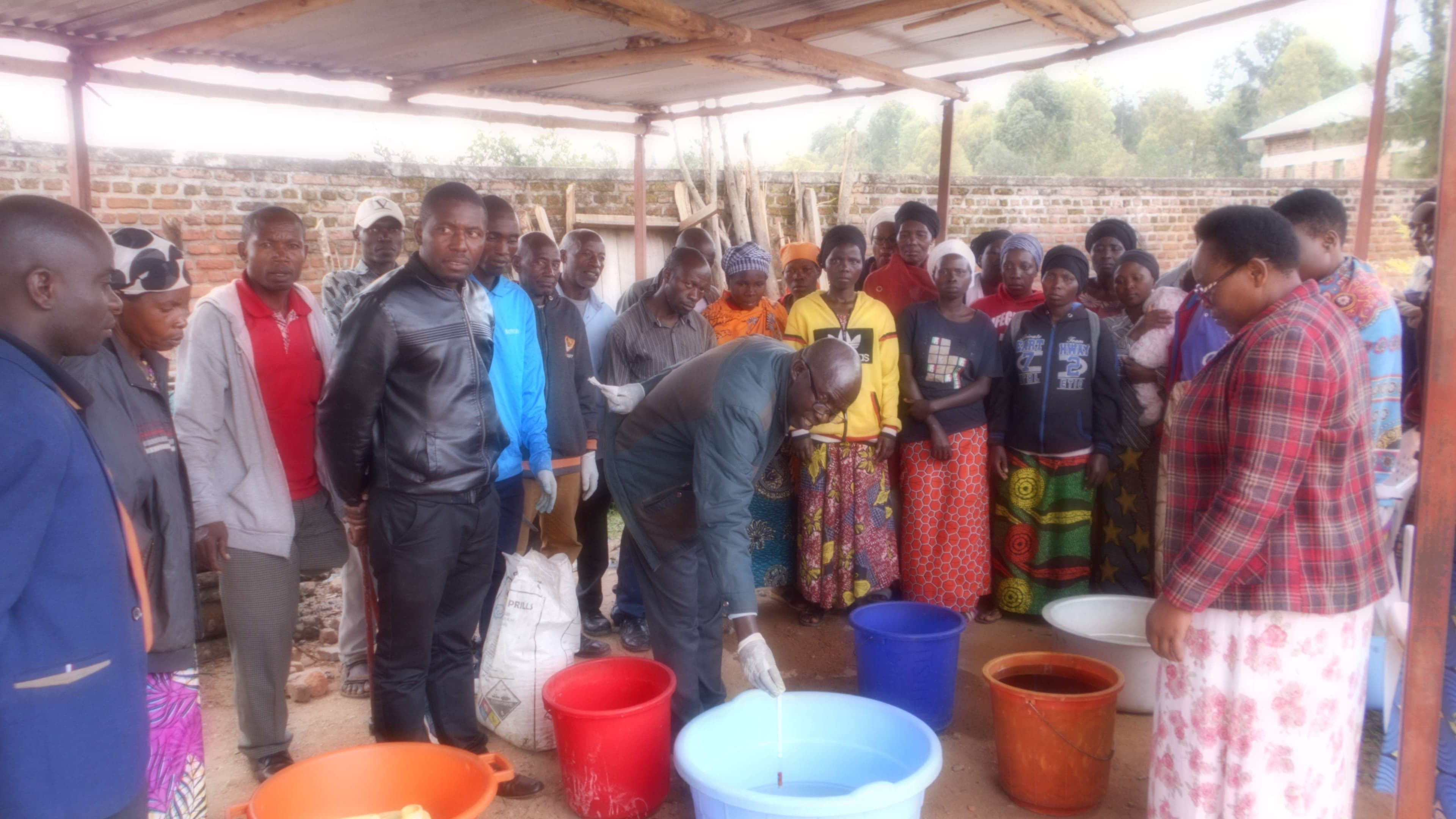 Caregiver learning about the mixing of products for soap making