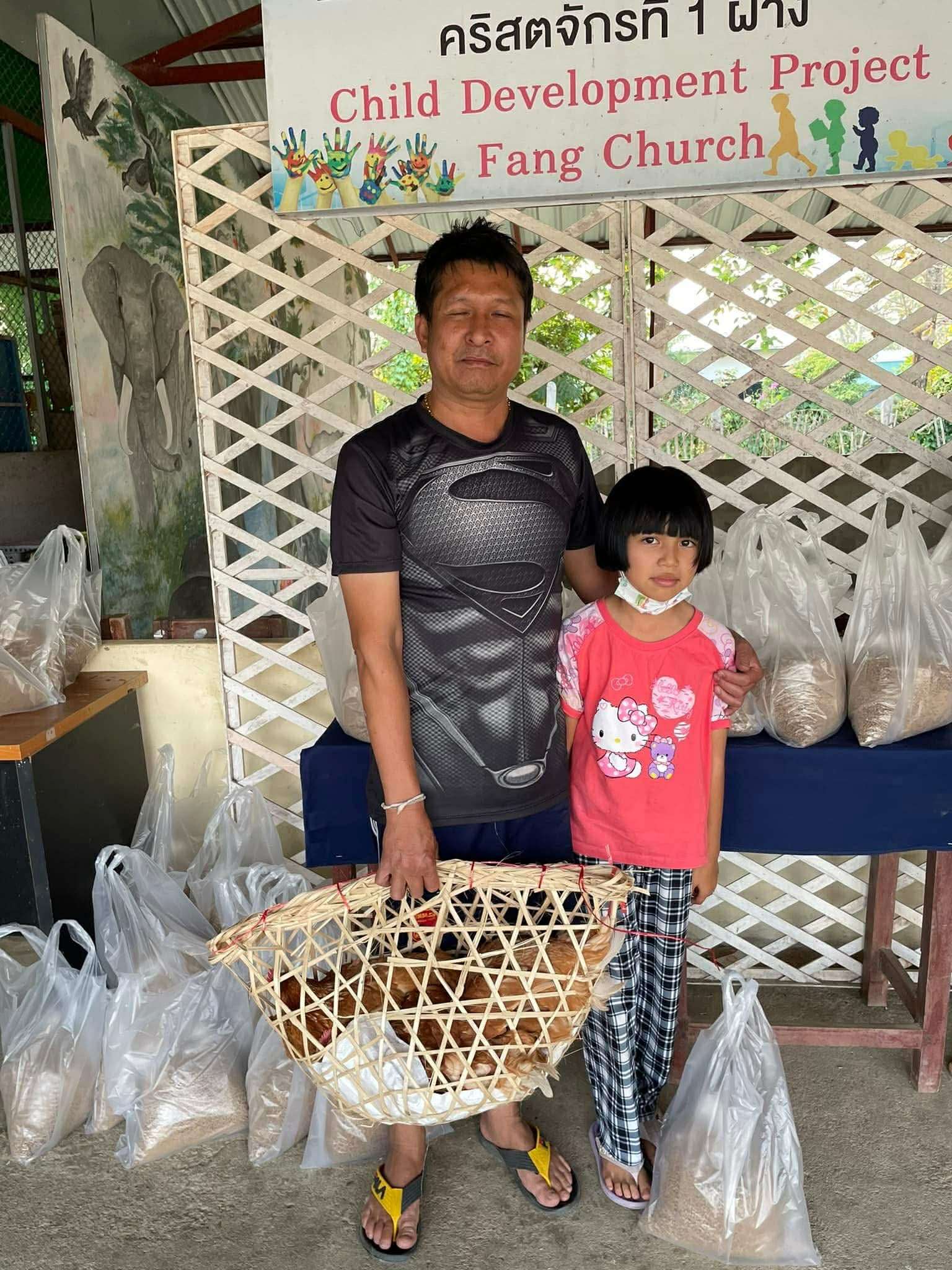 Children in the project receive egg-laying chickens.
