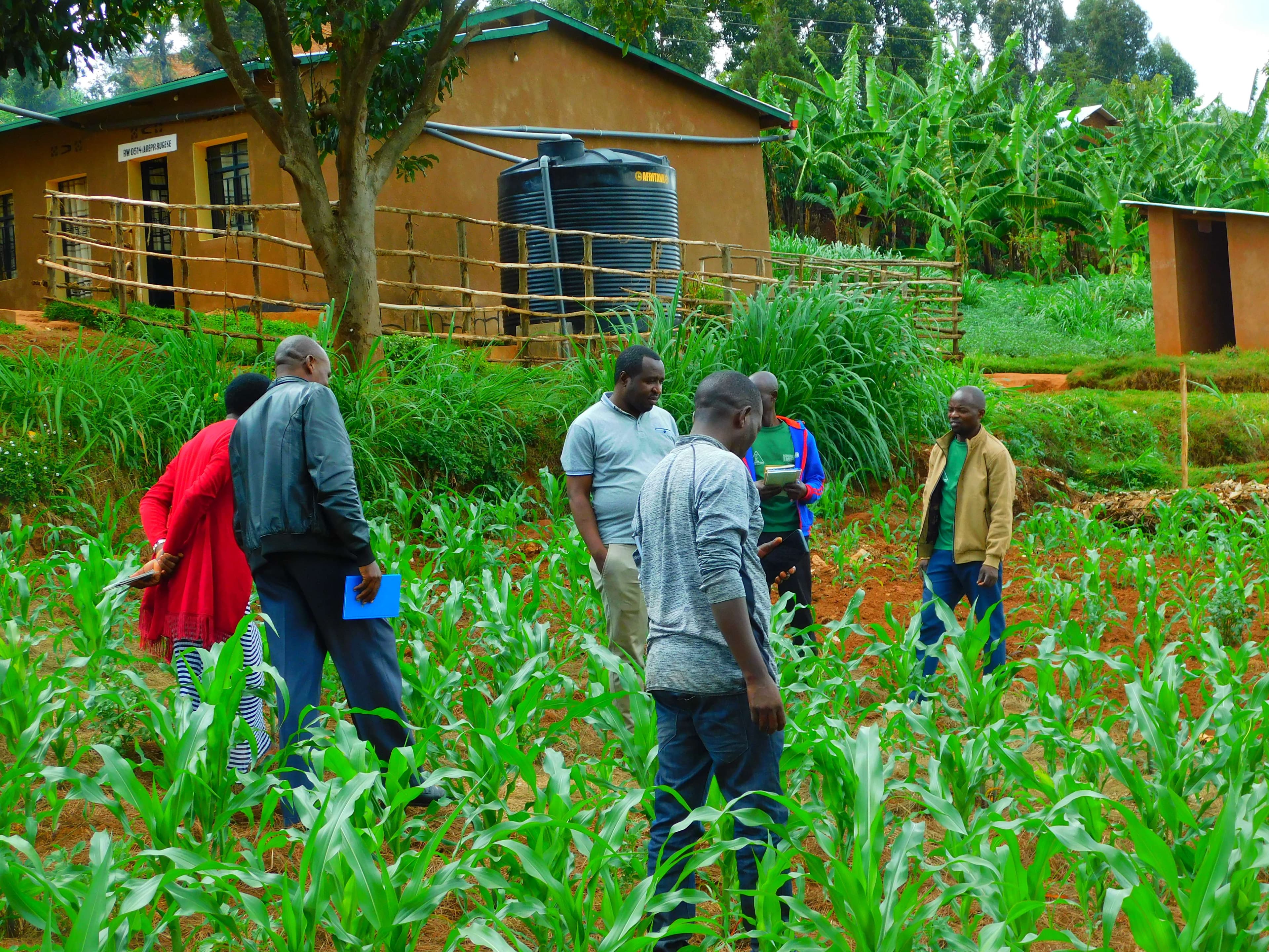 Caregivers during the visitation of one of their farms near the church.