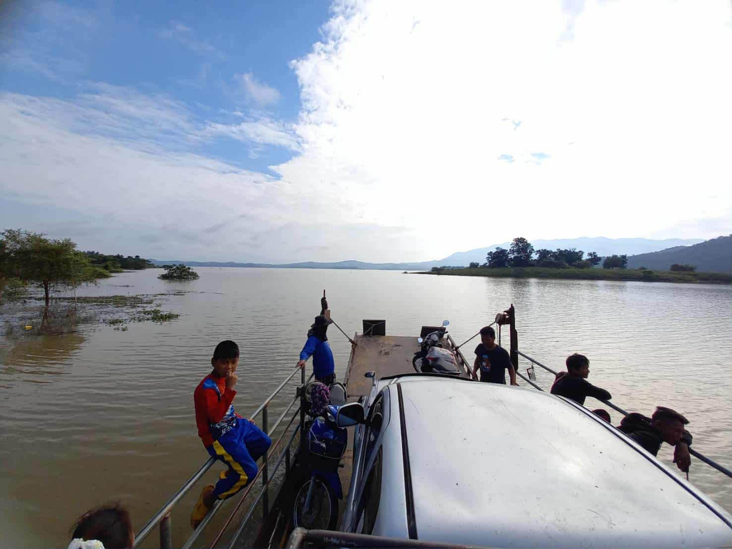 Facing the elements: A life-threatening journey awaits as our children prepare to cross the river.