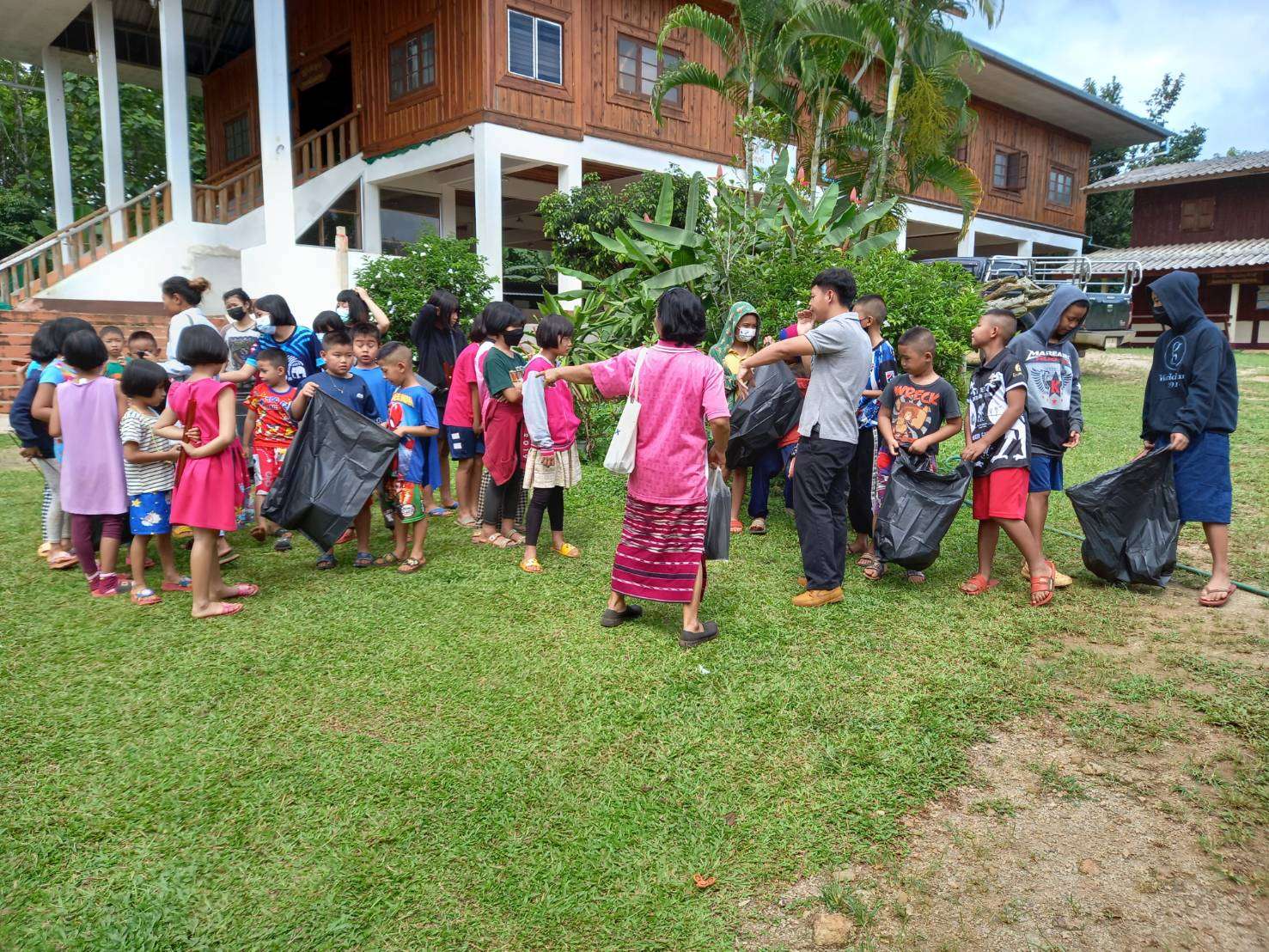 Introduce children to different types of waste by public health officers.