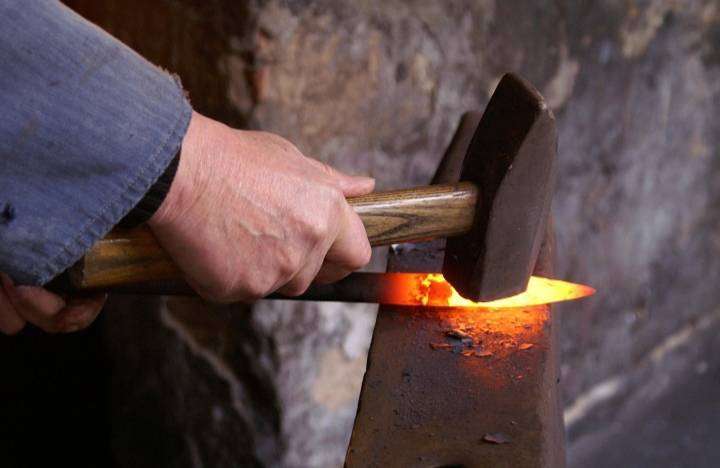 Demonstrating the knife-making technique, which is taught to the youth in the village.