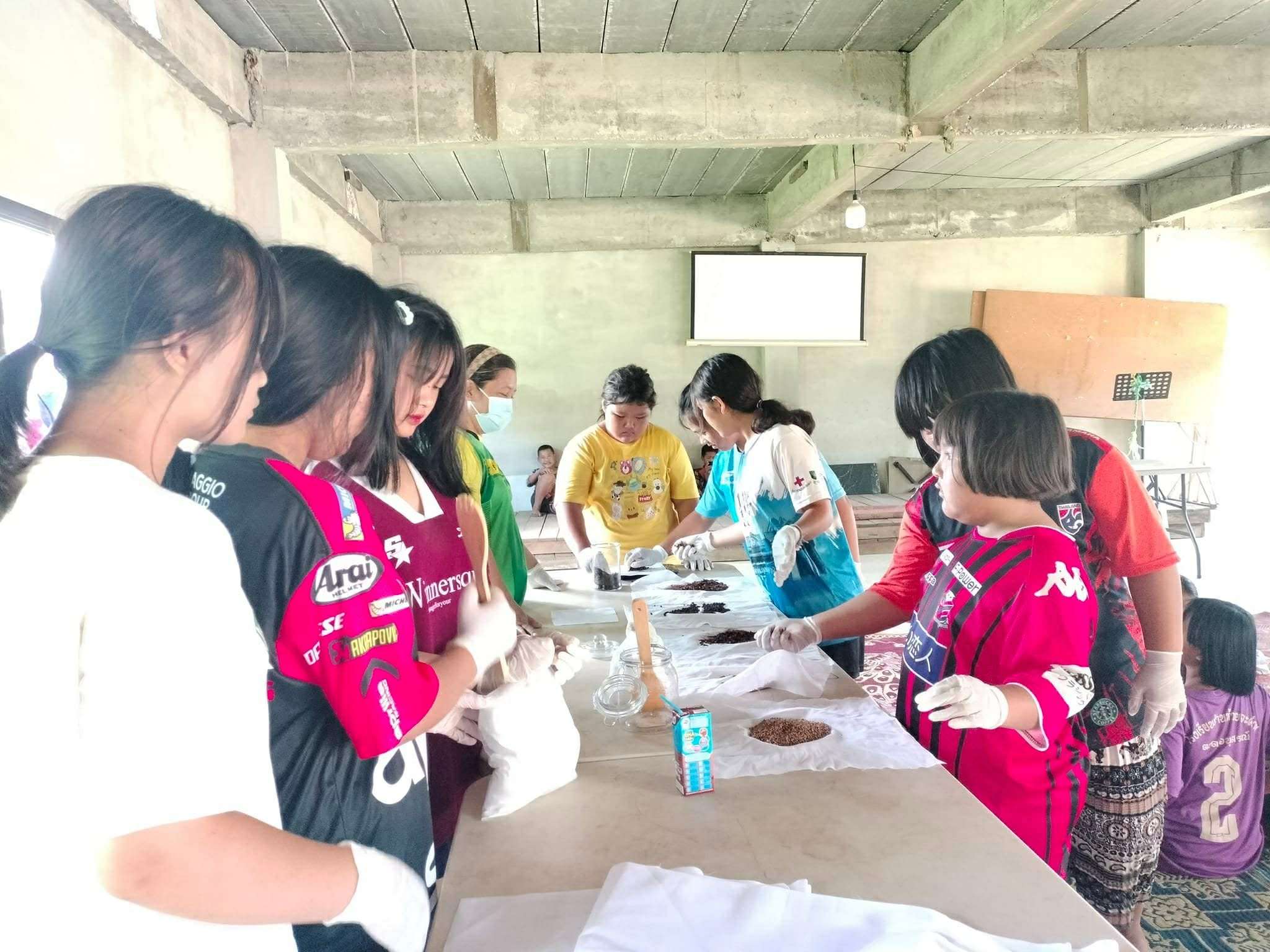 Measuring Up: Children and youth weigh each ingredient carefully, learning the importance of precision in herbal product creation.