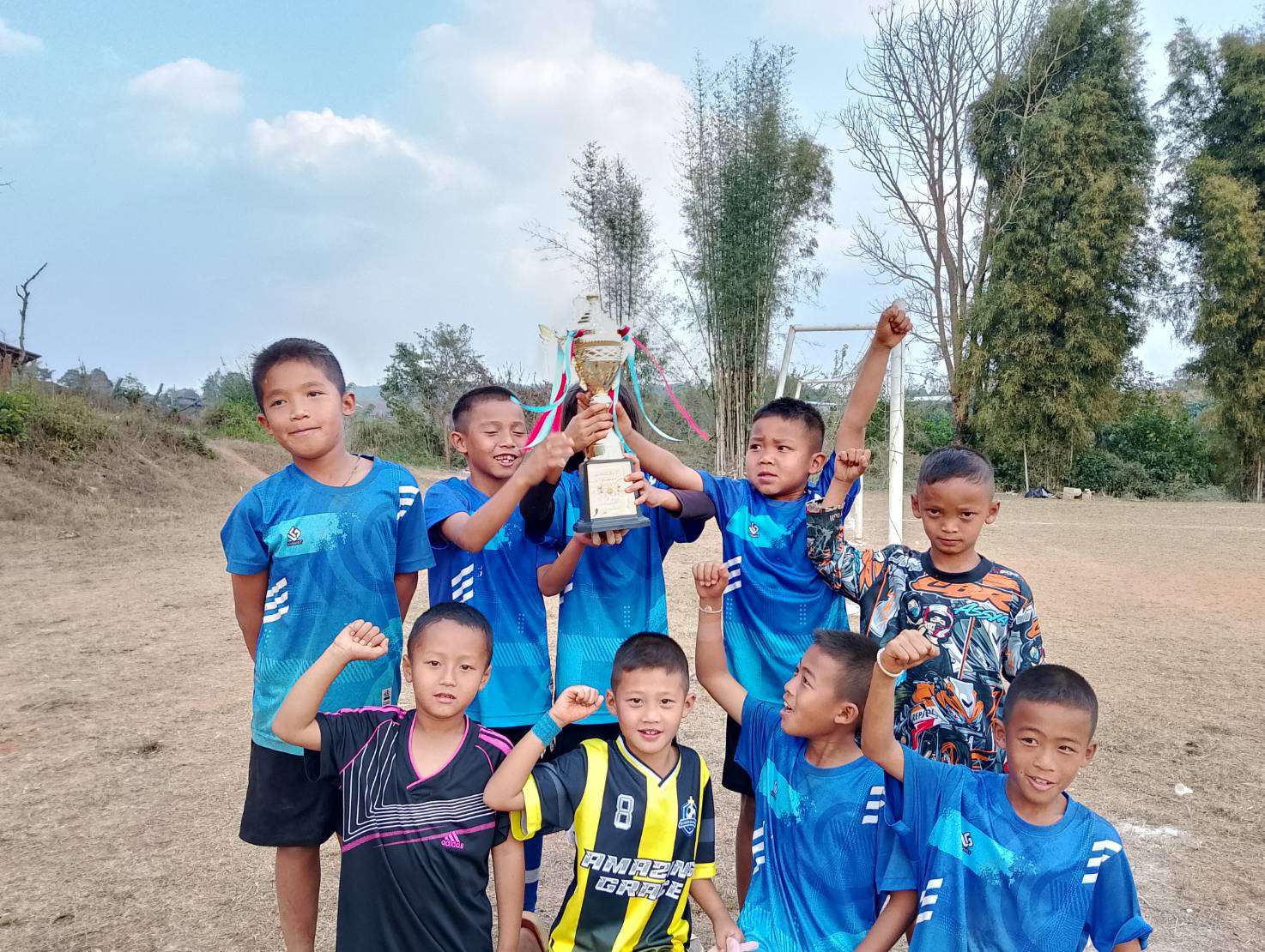 The children were thrilled to receive their first trophy.