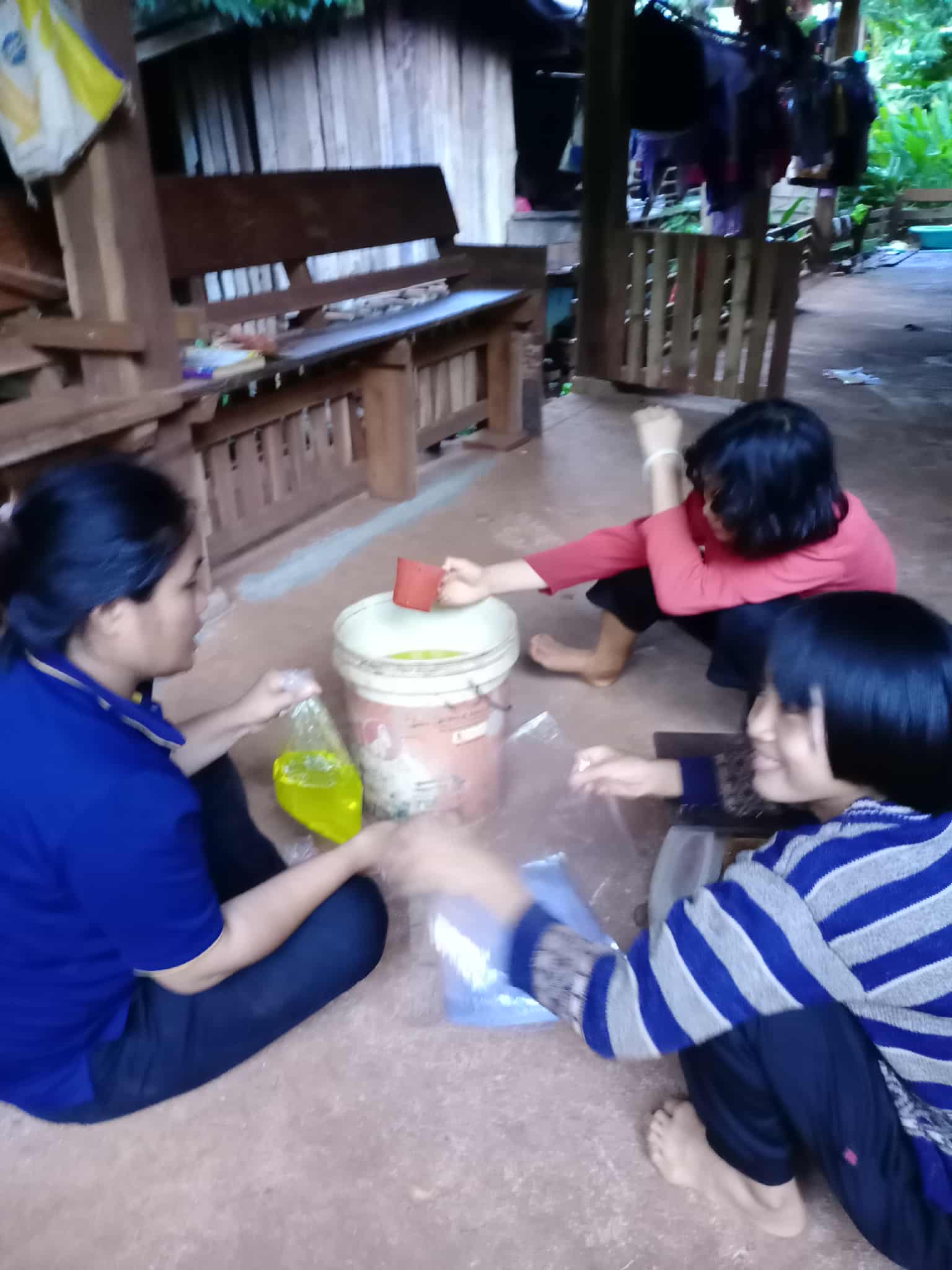 The youngsters are helping to pack the products into bags.