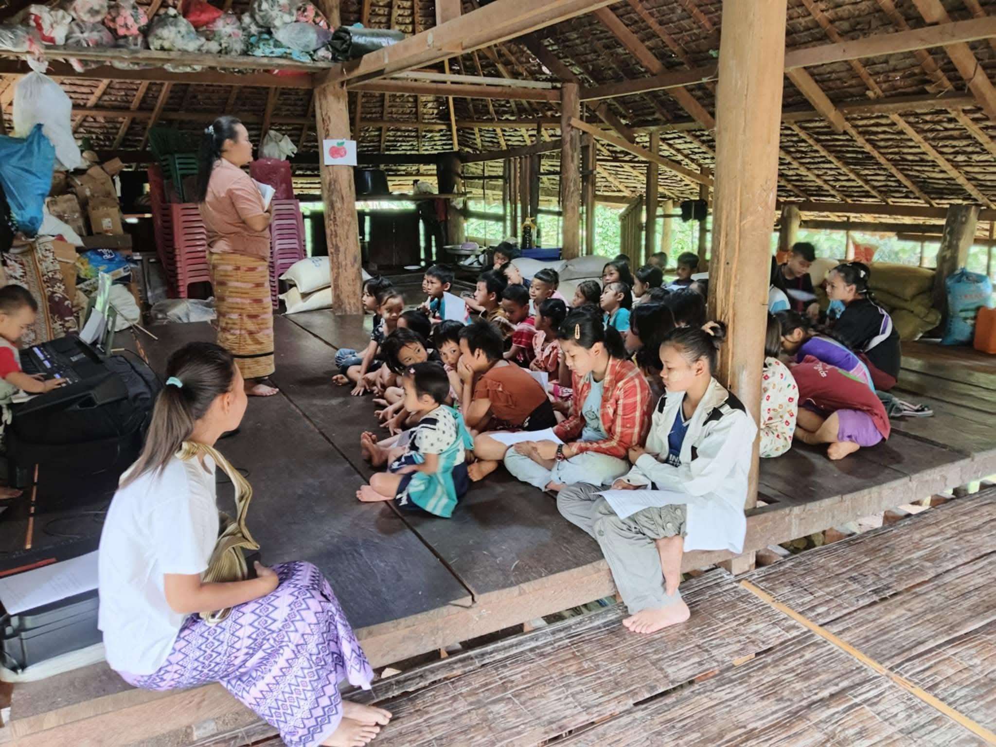 These children are underprivileged and study in a hut.