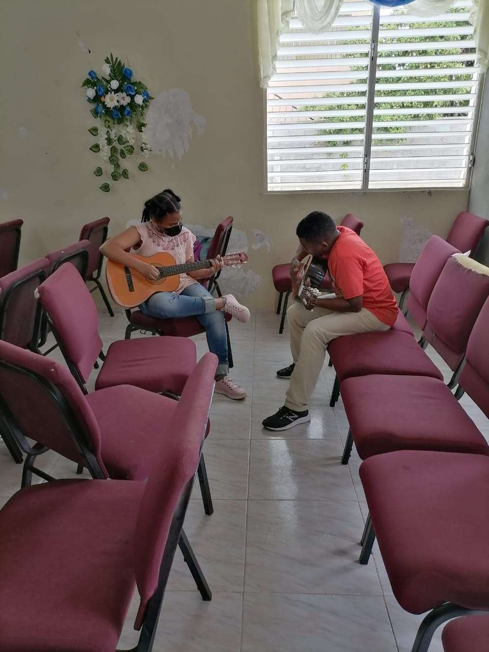 Our teacher teaching guitar class