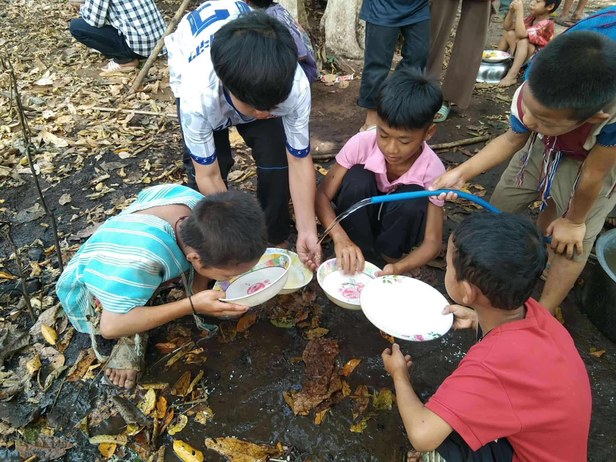Children use water for drinking and cleaning dishes.