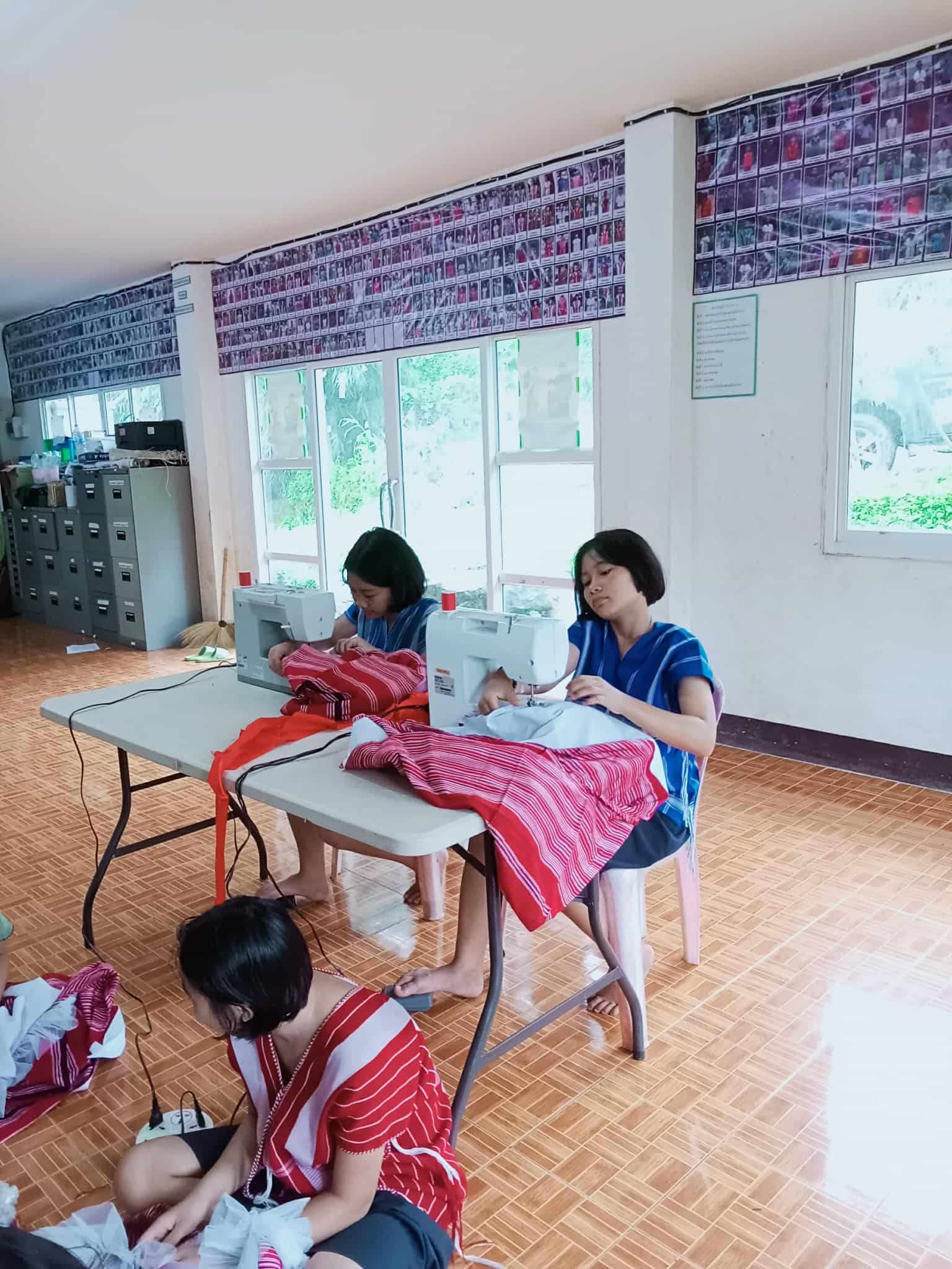 Children engaging in practical sewing exercises.