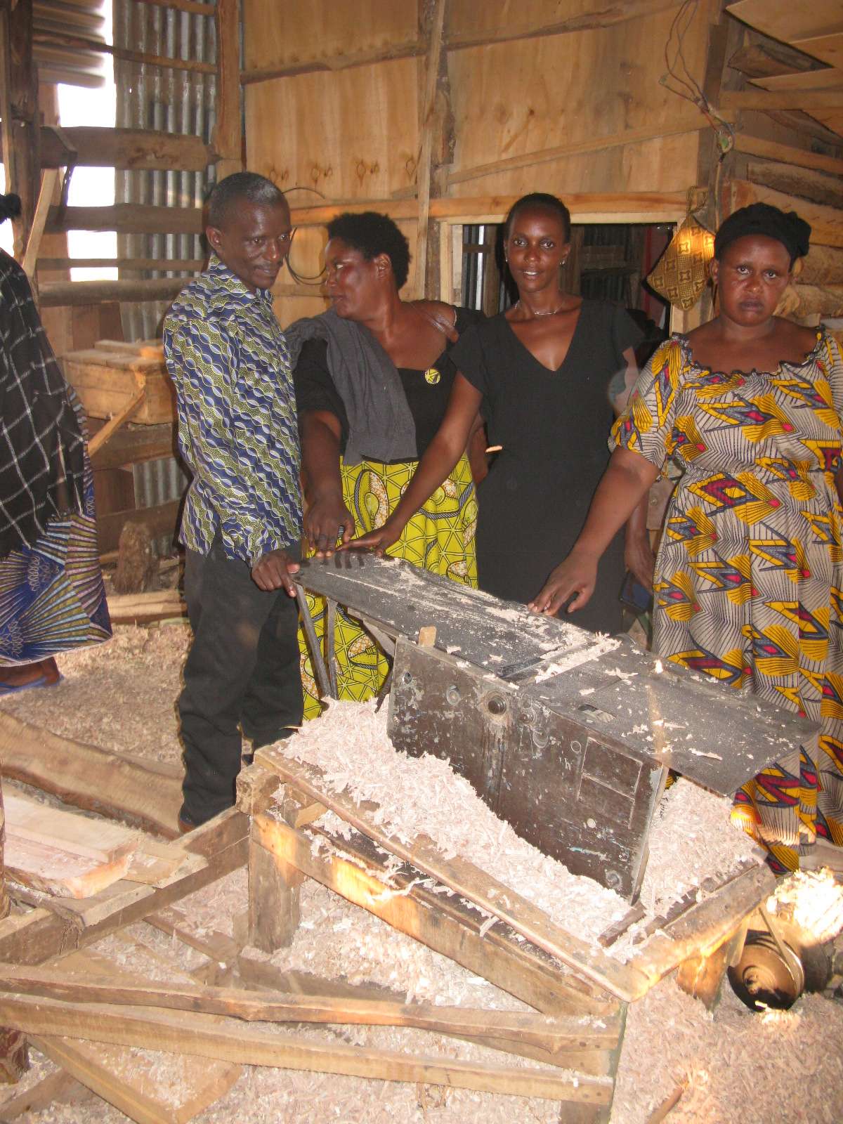 Members of the association demonstrate how the Wood Cleaning machine works.