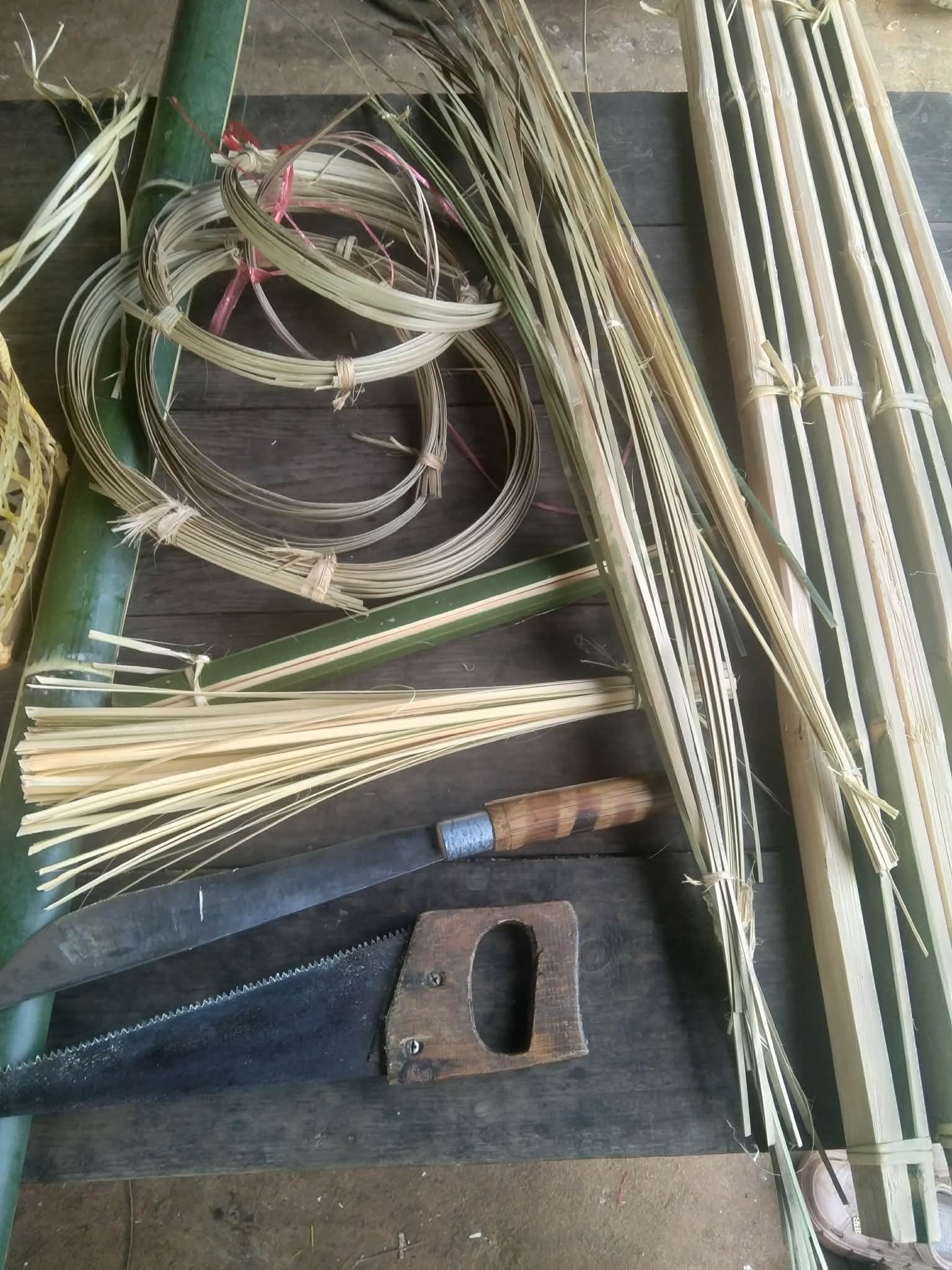 Essential Tools: A glimpse of the materials and equipment utilized in the bamboo weaving operation, supporting skill development and creativity.