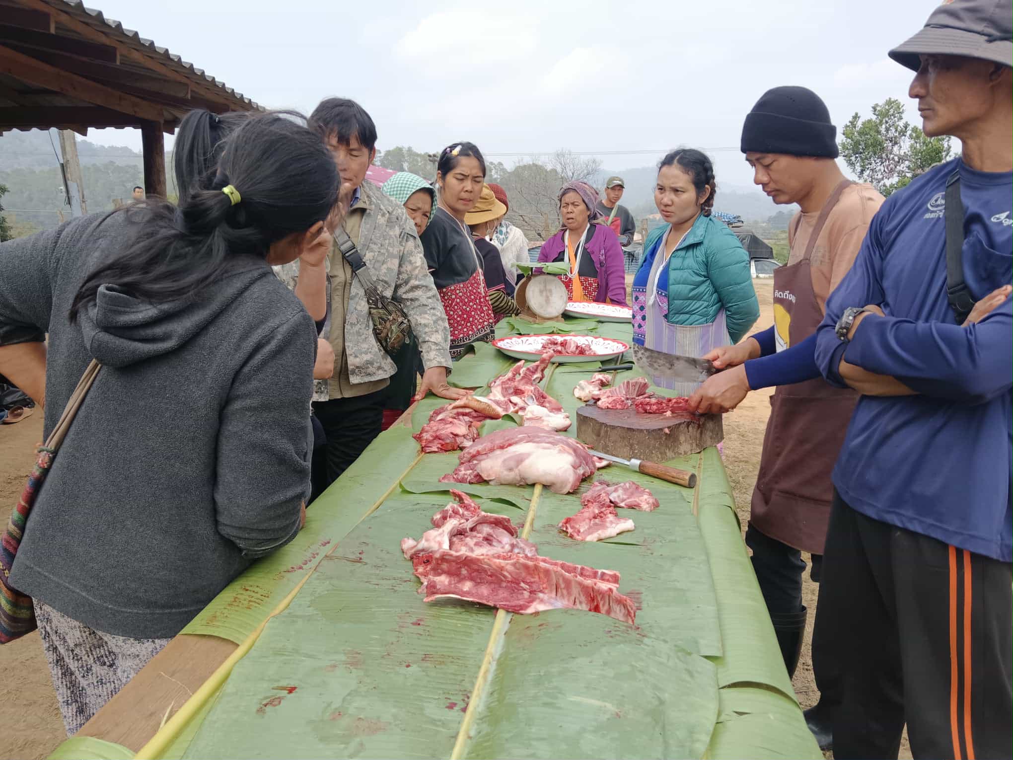 Preparing the pork by dividing it into suitable pieces.