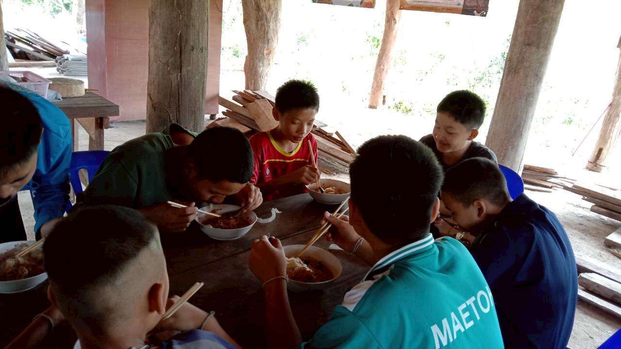 Children happily eating together.