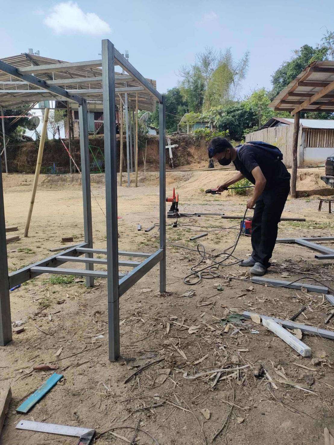 Session in action: Participants actively practicing welding techniques under expert guidance.