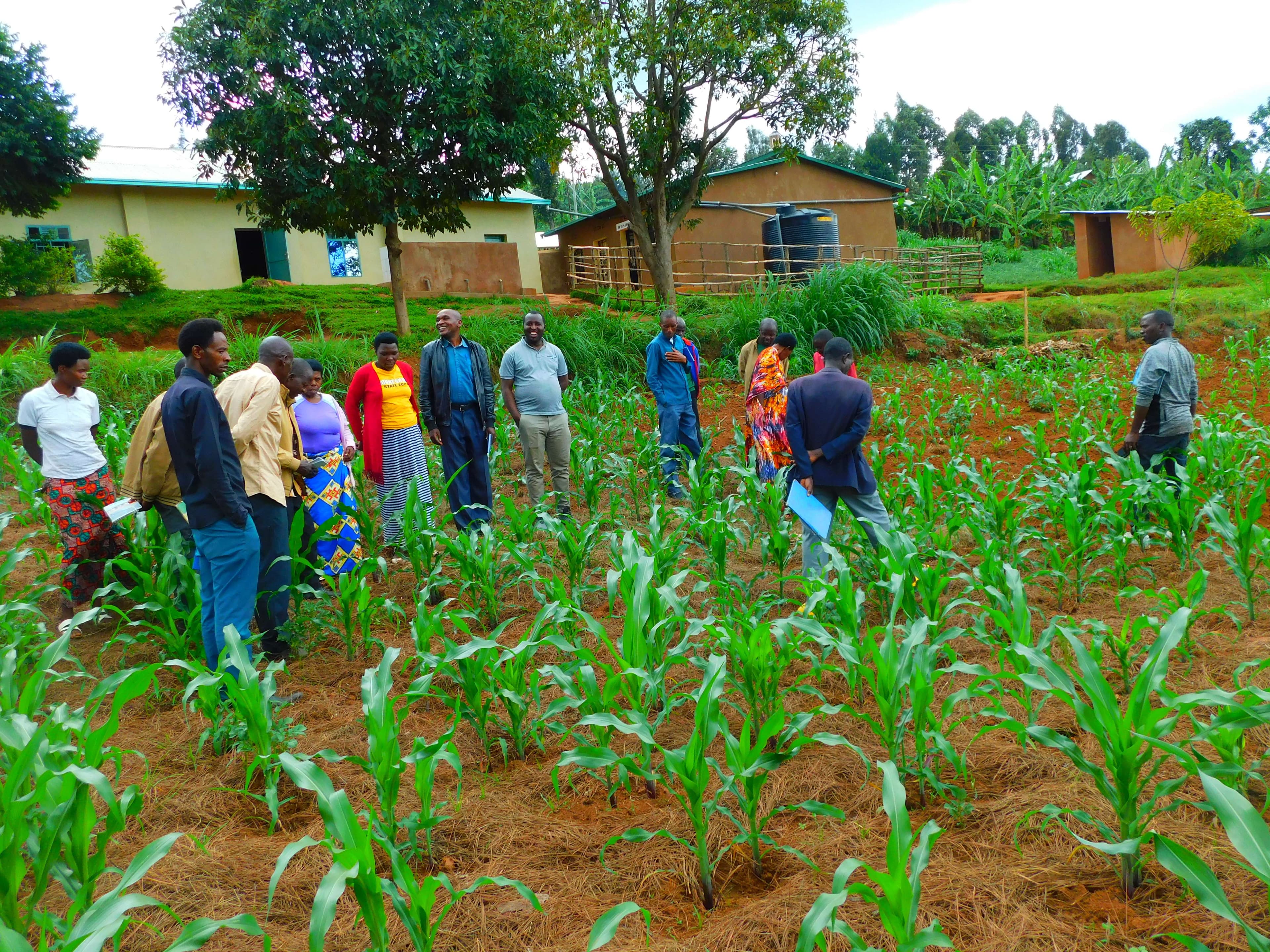 Caregivers during the visitation of one of their farms near the church.