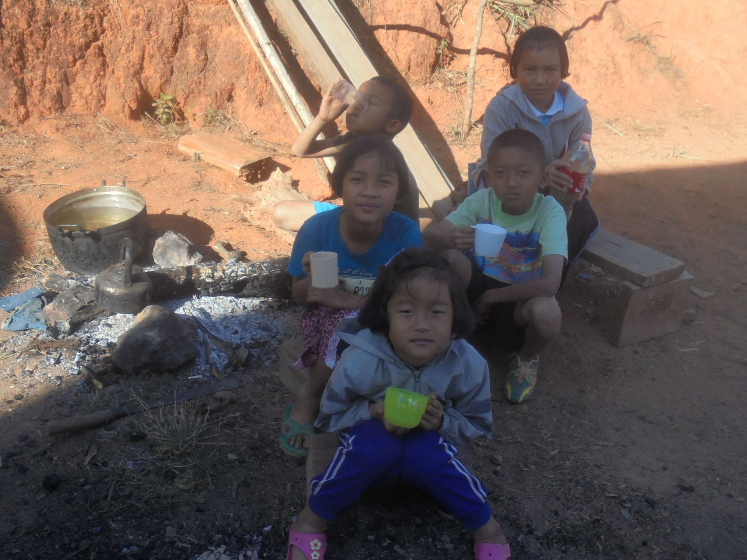 The children gathered and drank quietly, trusting the water that had been carefully boiled to keep them safe.
