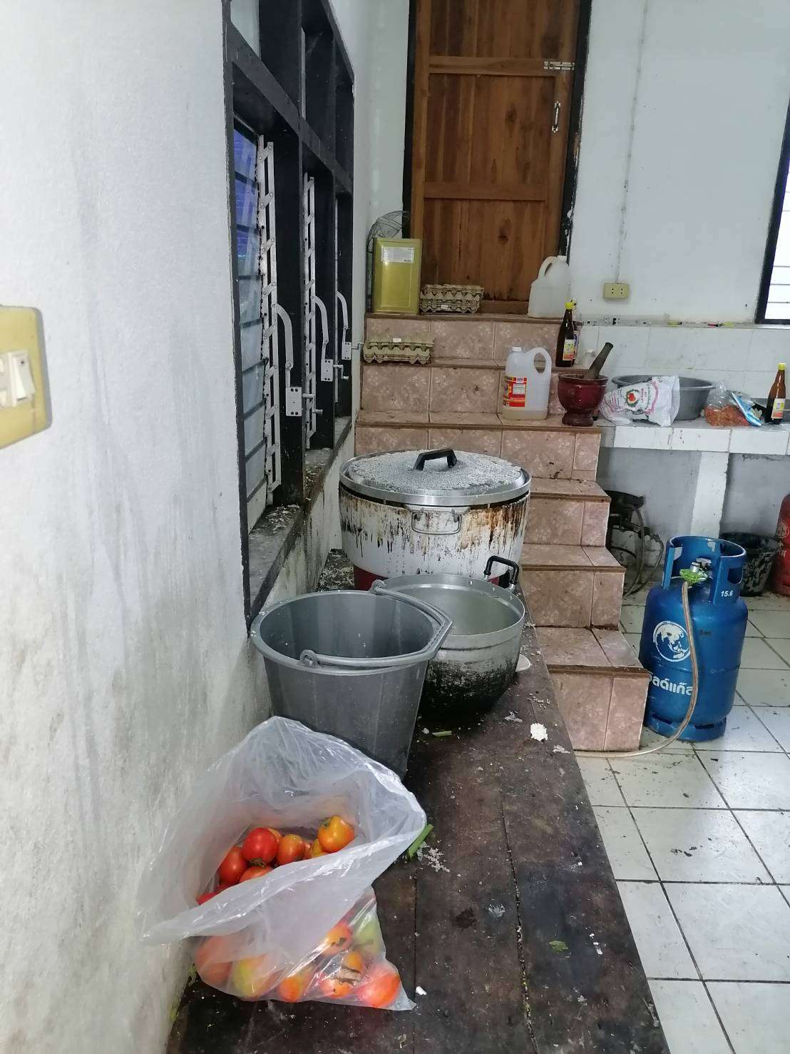 The current kitchen is located near the entrance to the bedroom.