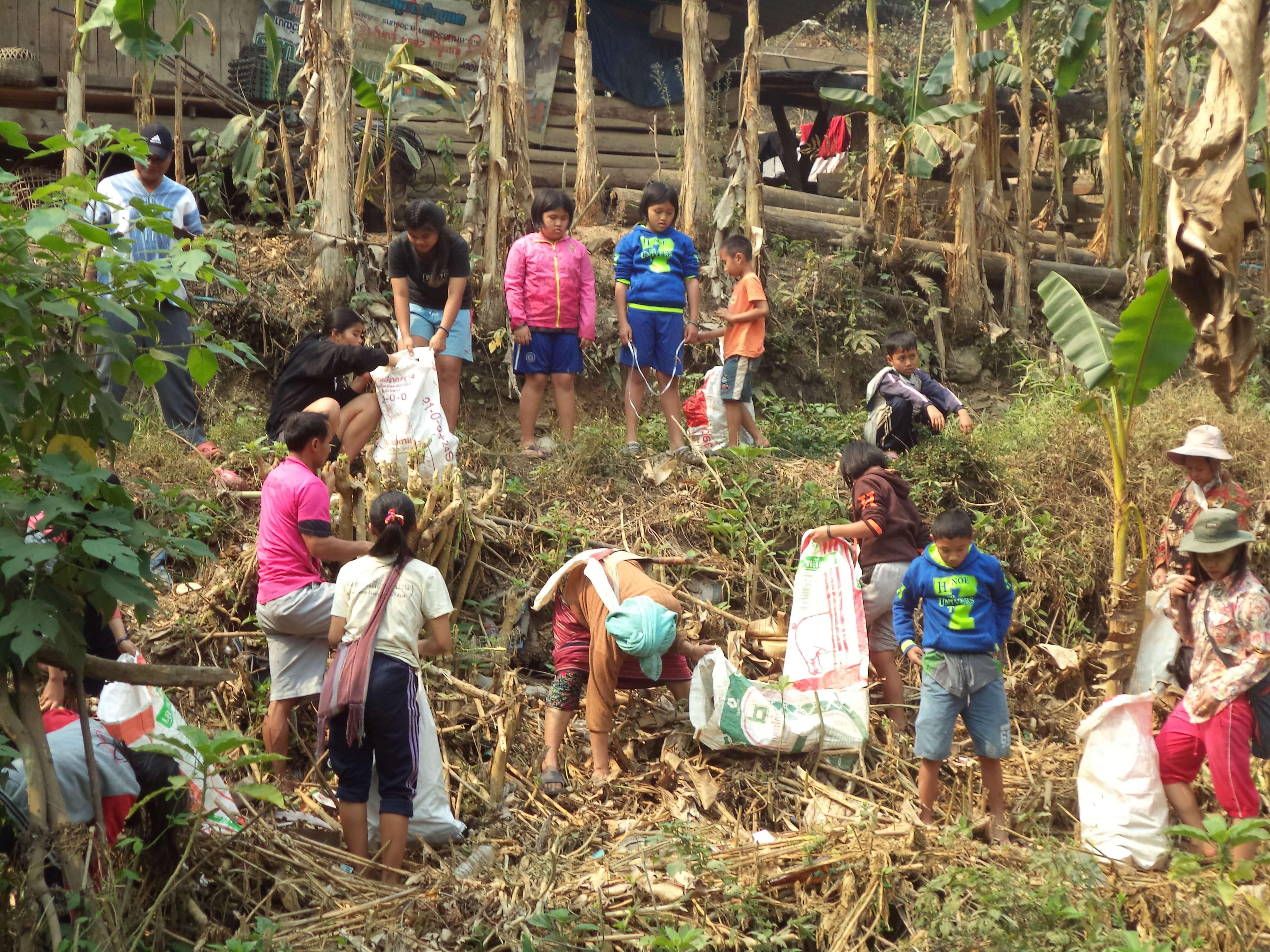 Children learn to collect garbage in the community.
