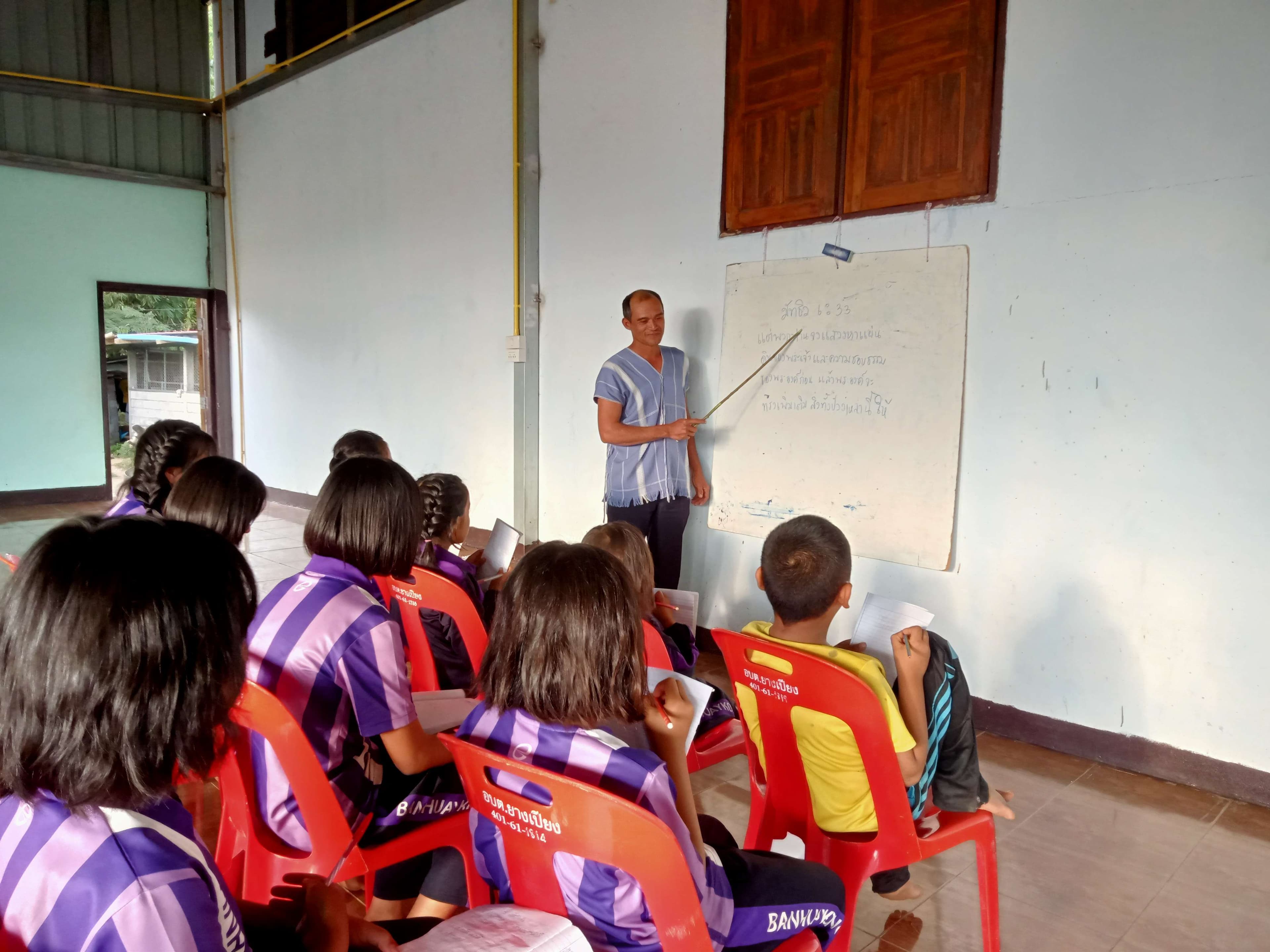 Teachers provide additional knowledge to children at church.