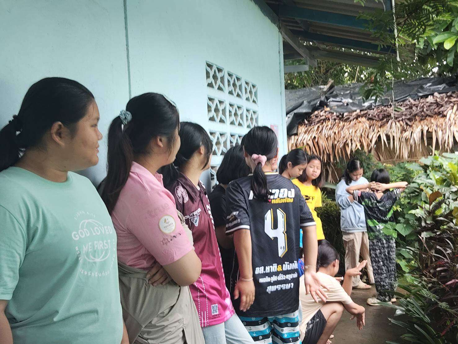 This picture shows the children waiting in line to use the restroom.
