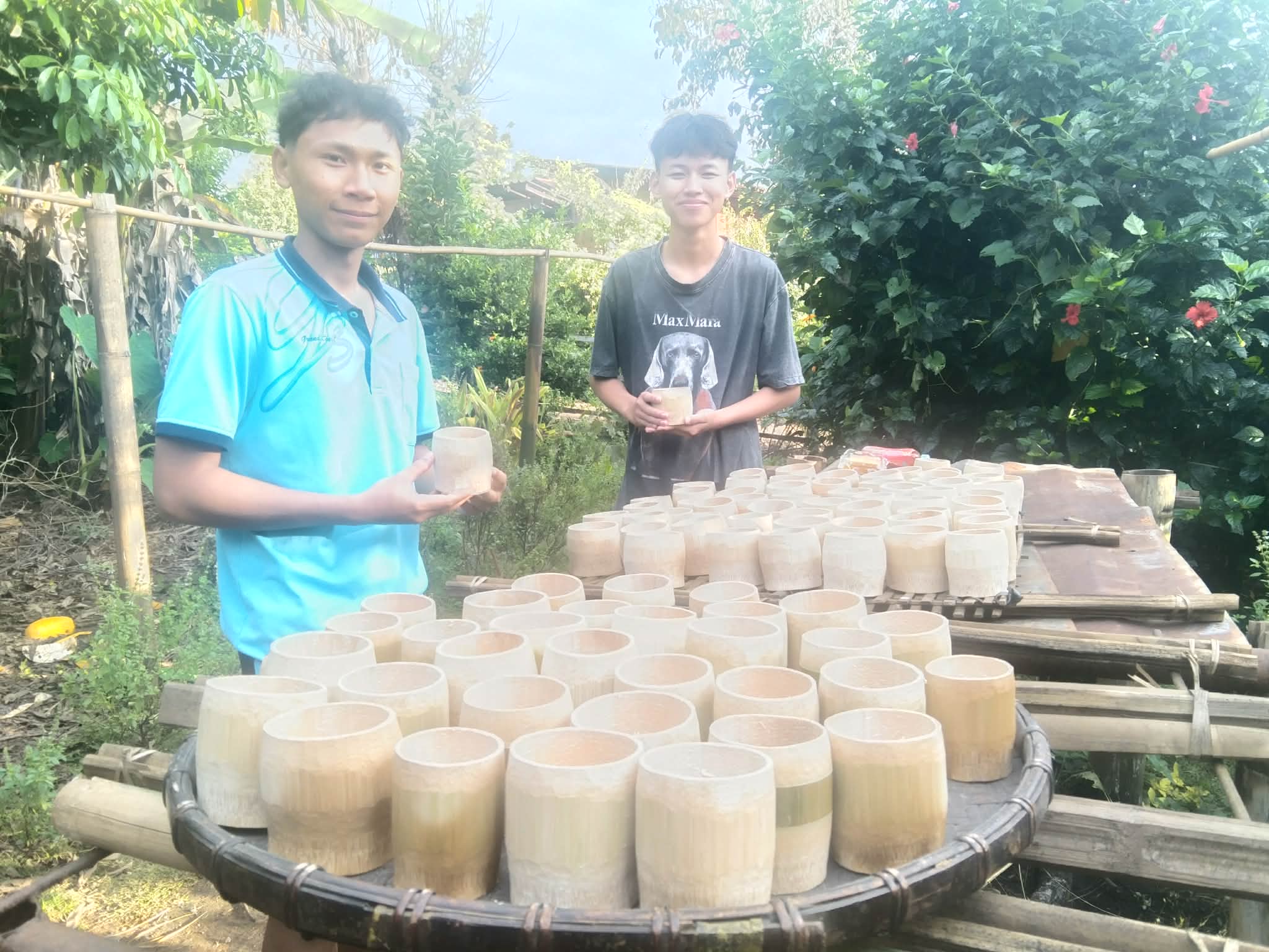 Crafting Skills: Youth embrace the art of making bamboo cups, blending tradition with creativity!