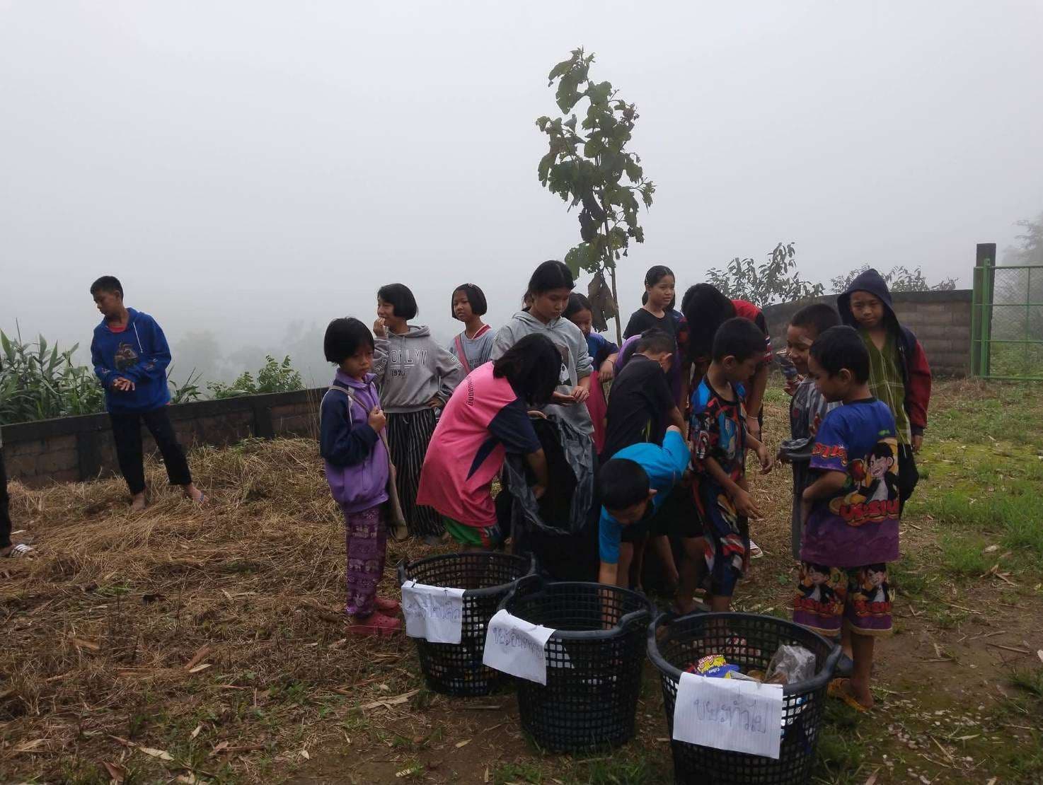 Local Children work together to collect and sort garbage.