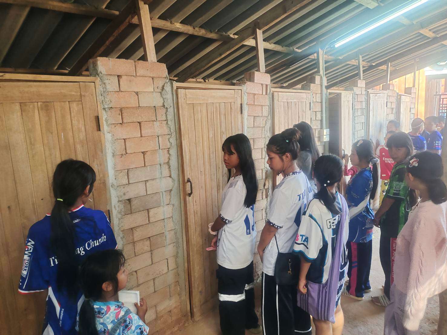 Due to the limited number of restrooms, children are often required to line up for extended periods to use the facilities.