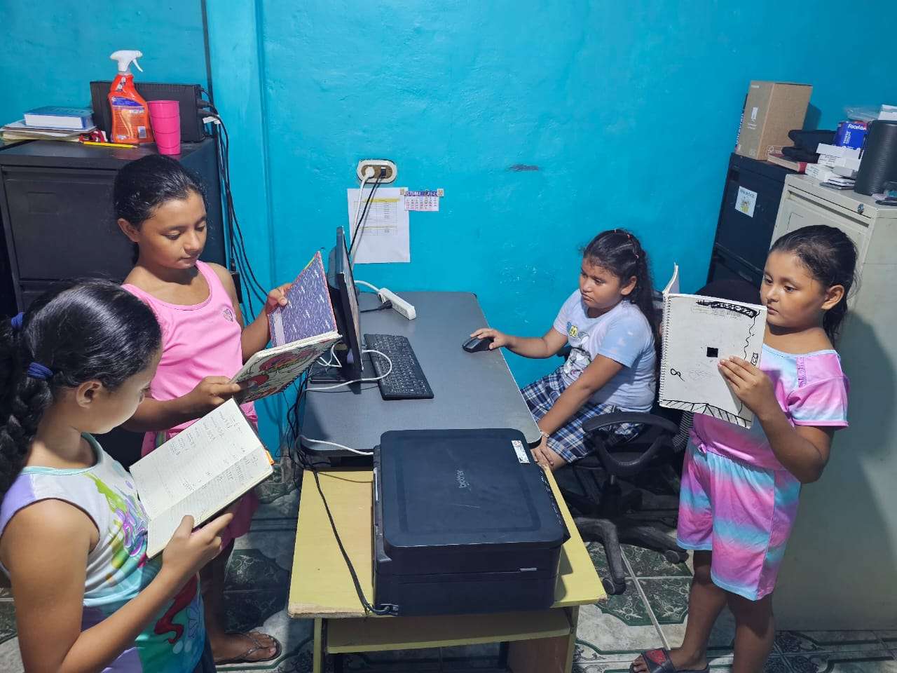 Children standing waiting to get their homework.