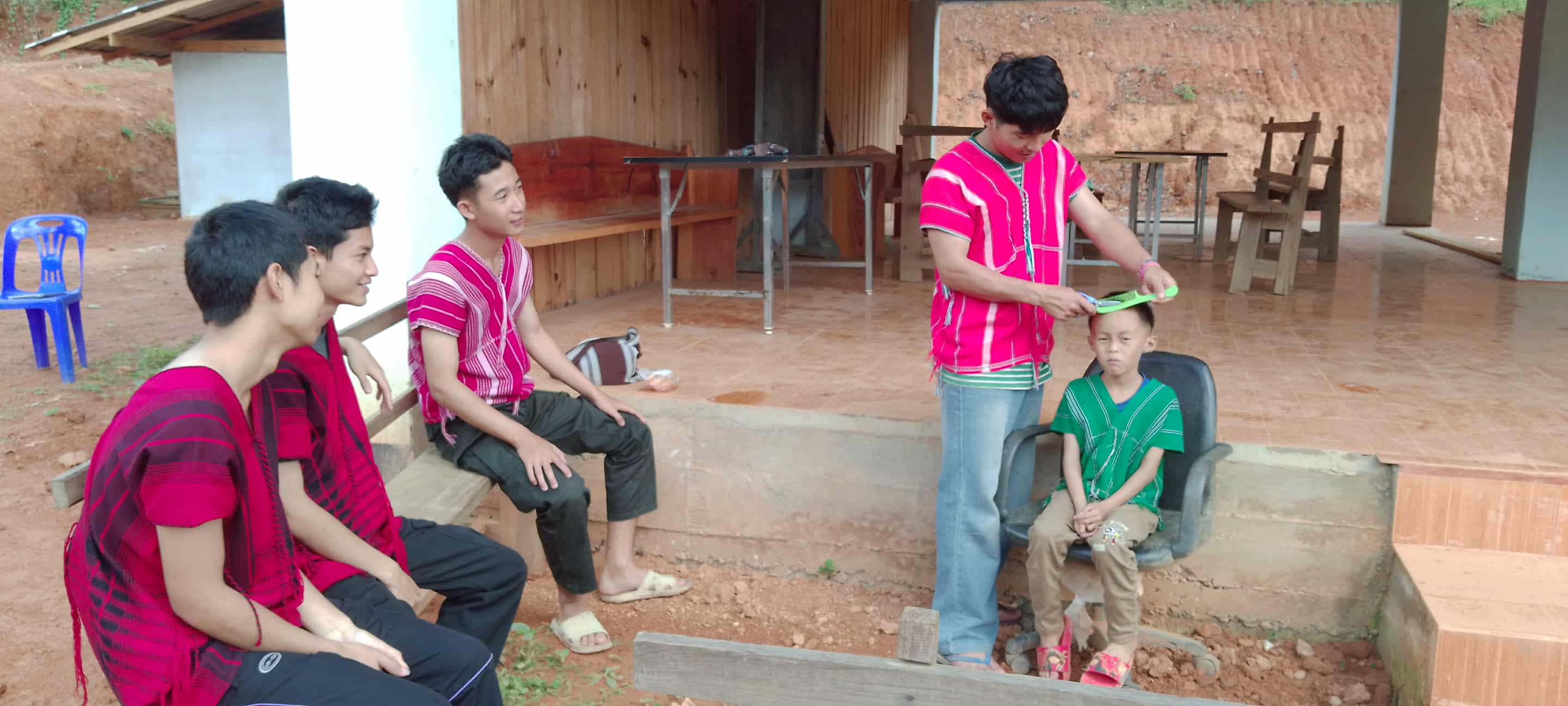 Young people are practicing hair cutting.
