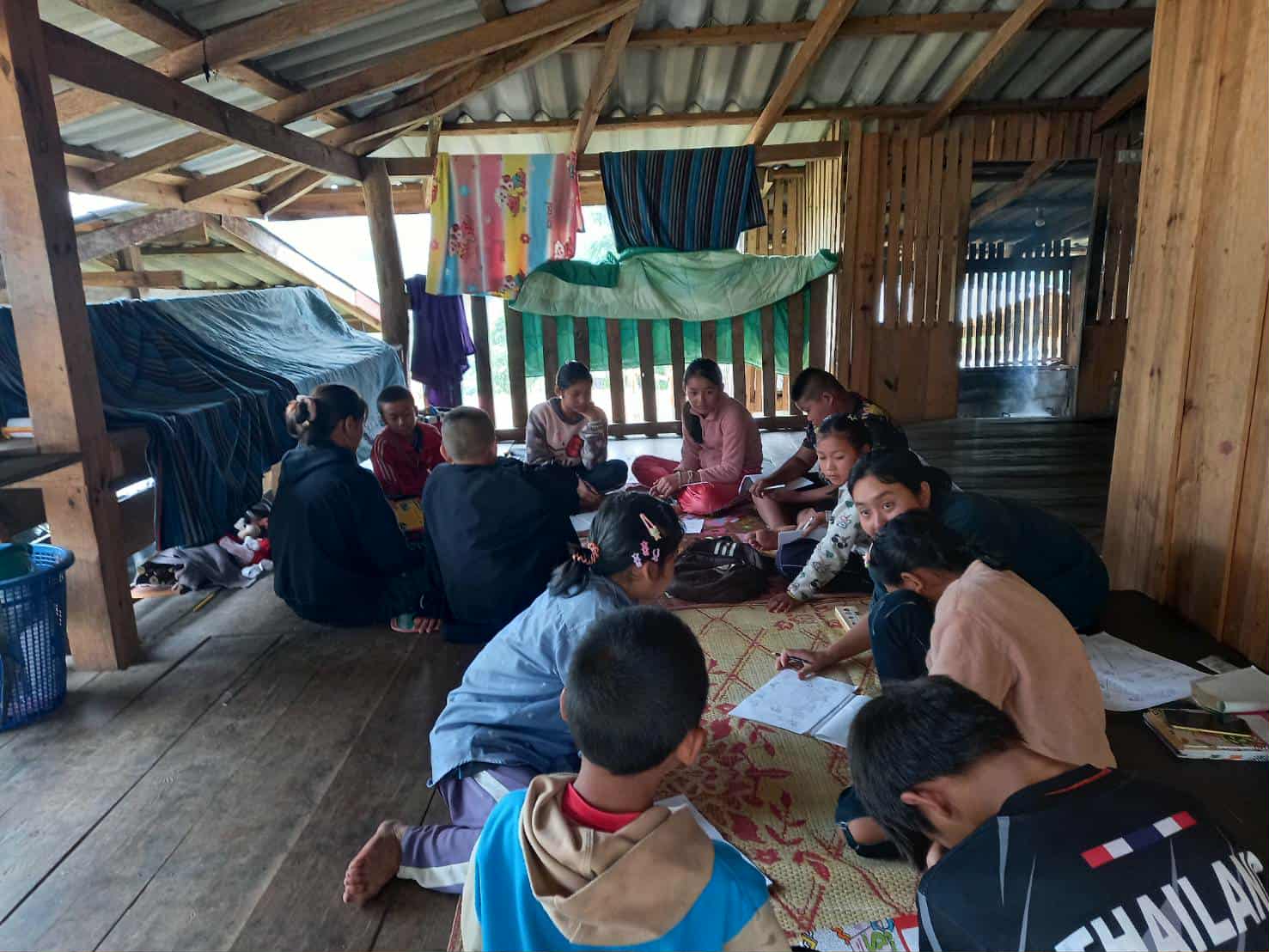 "Active Together: Children and parents engage in activities, showcasing their creativity and connection despite the lack of chairs and tables."