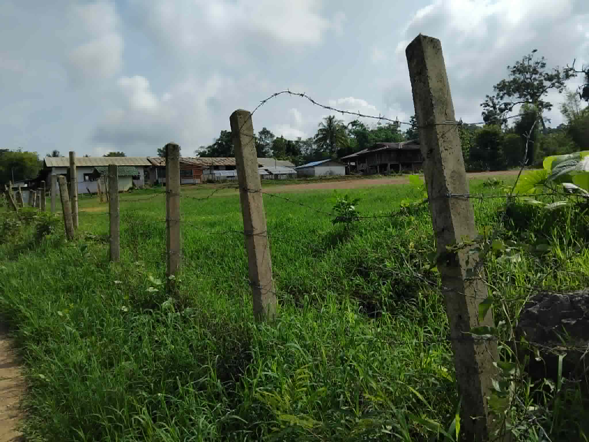 The damaged and broken fence creates an unsafe environment for children, increasing the risk of accidents and injury.