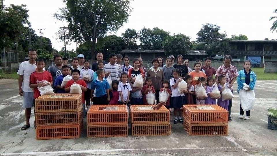 Children in the project receive egg-laying chickens.