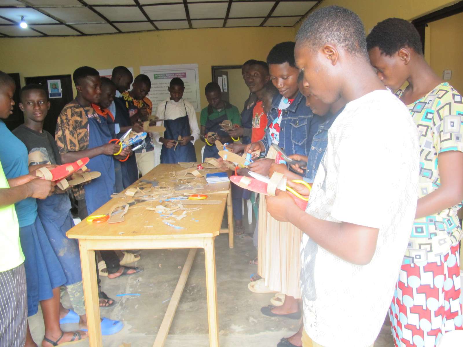 Participants are showing the final stage of shoes made by themselves.