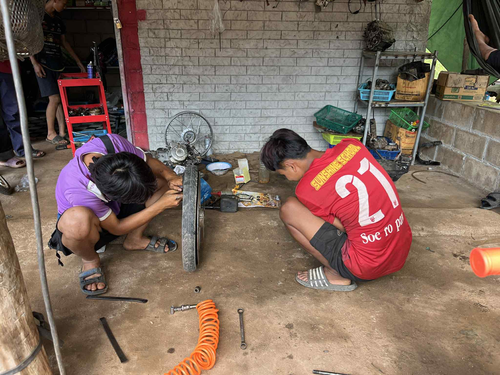 Concentrated effort: Committed to mastering tire repair skills!