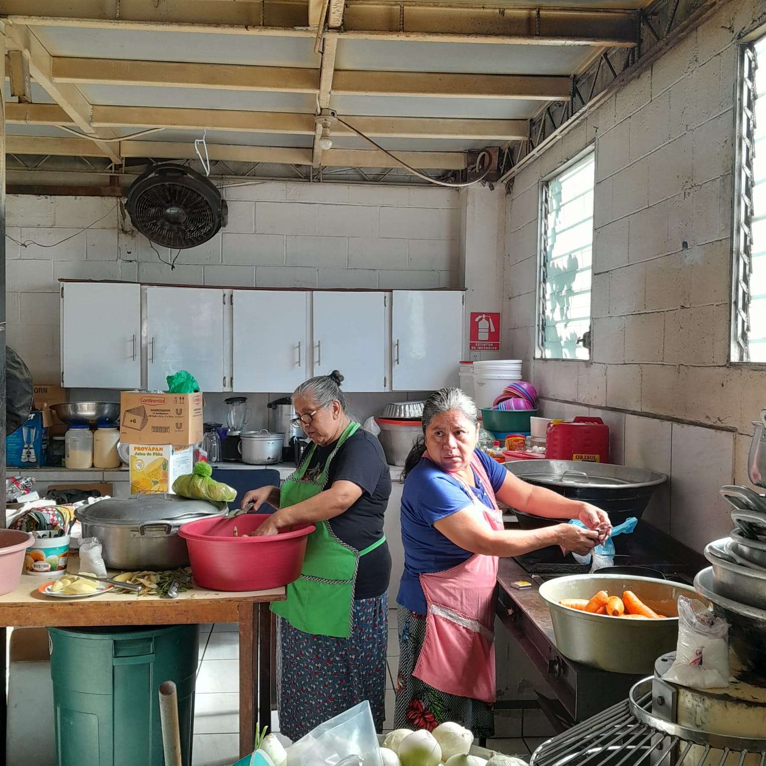 The sisters making snacks for the children