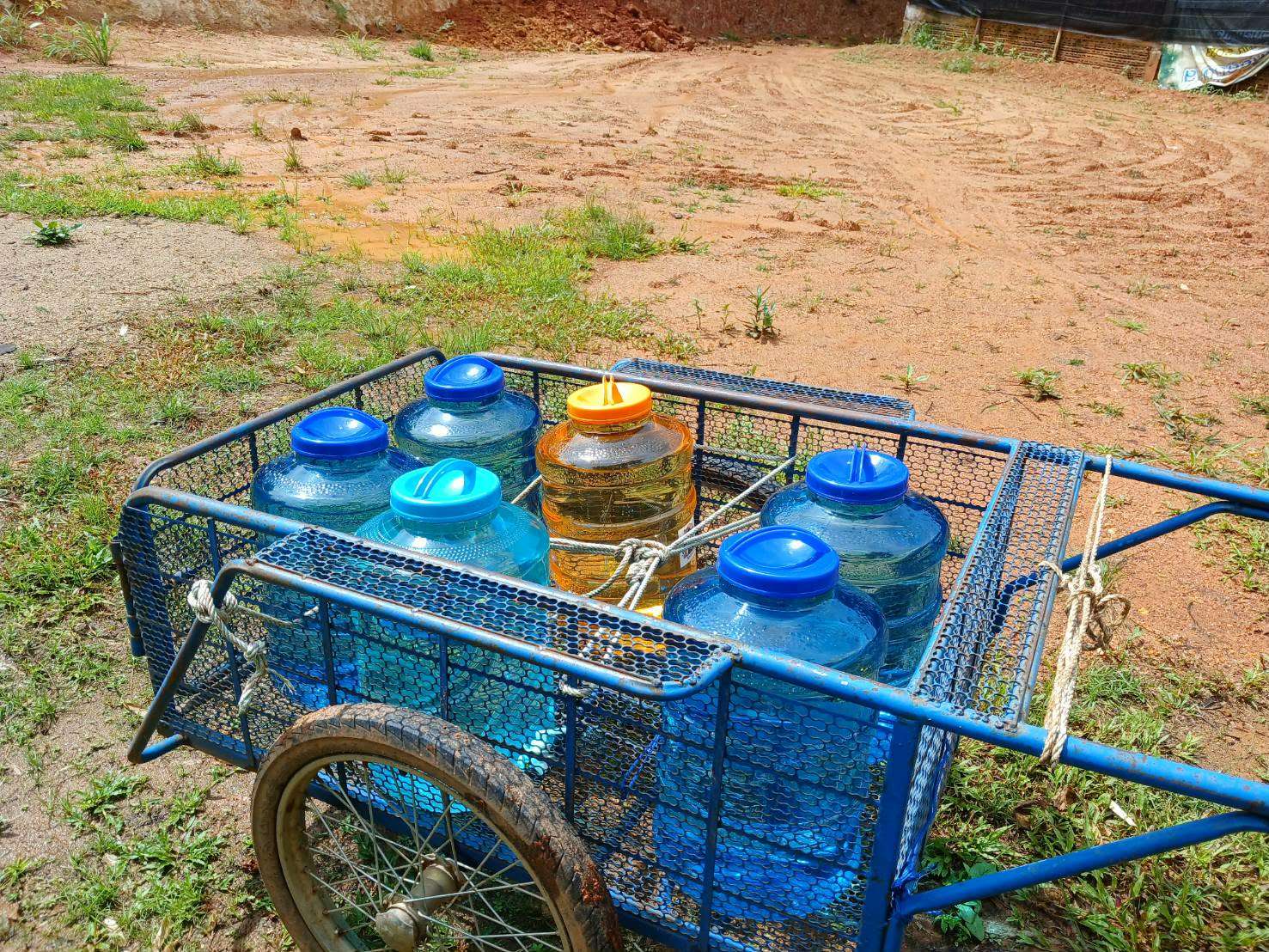 Villagers travel to the reservoir to collect water for their daily needs