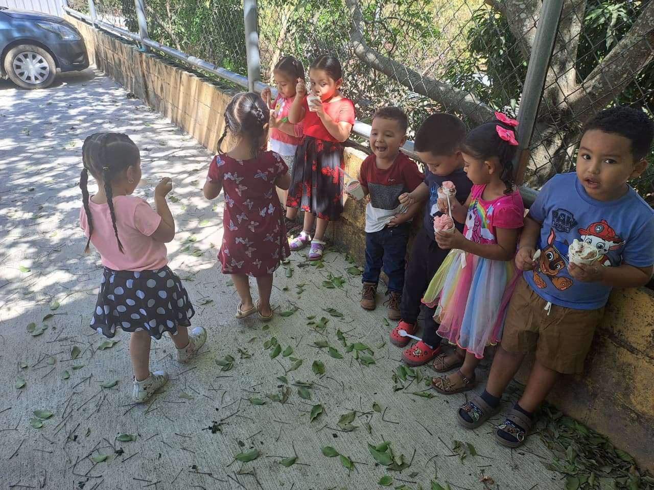 Participants being served in the church courtyard