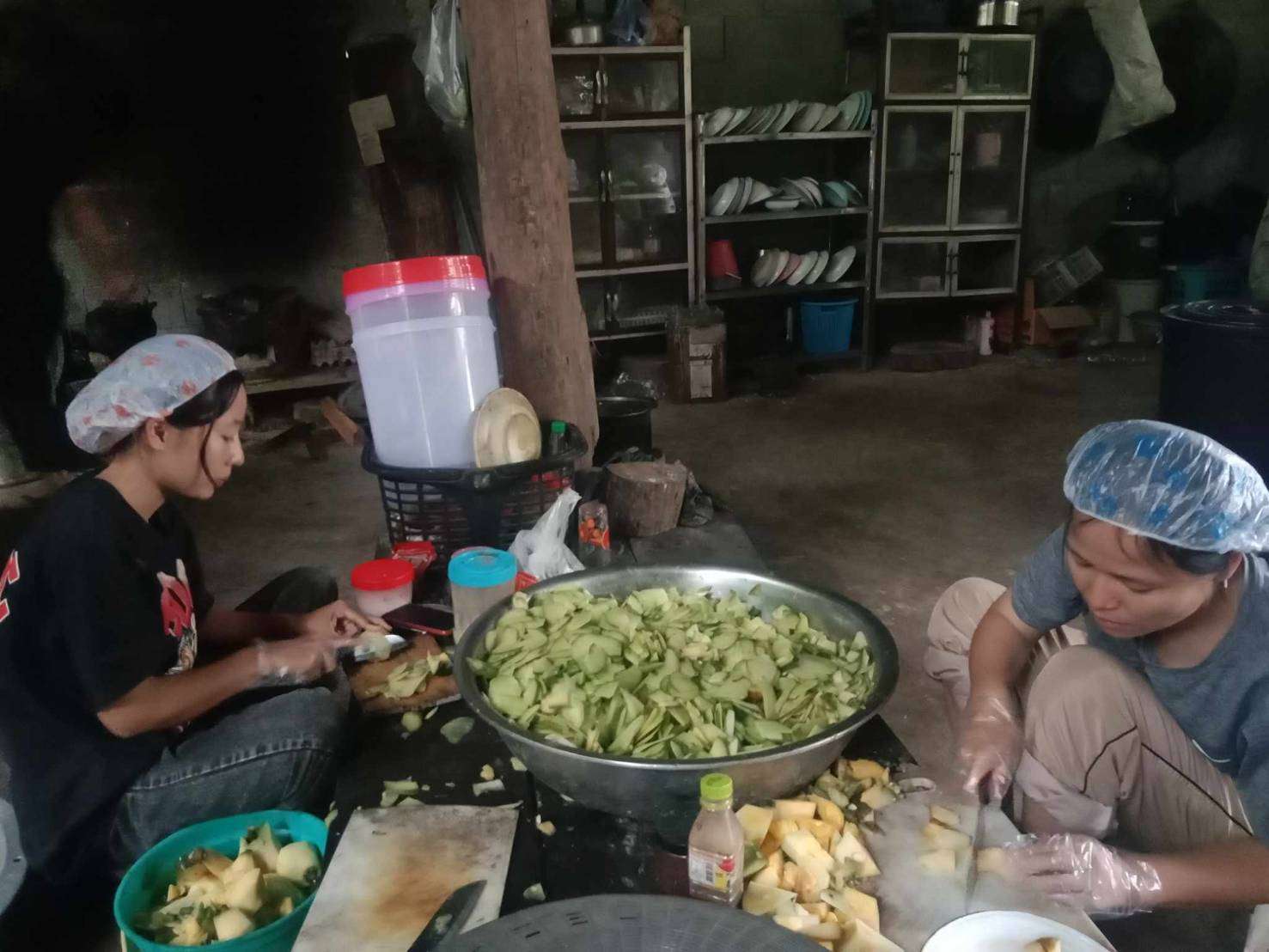 Taking action: Preparing herbs for processing.