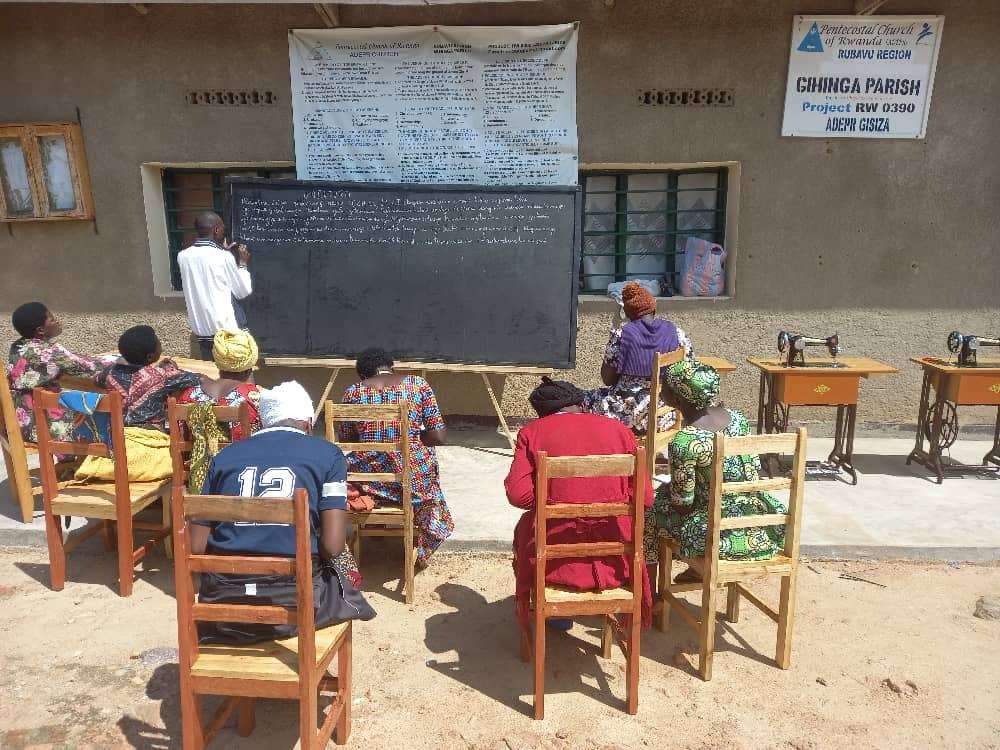 The photo shows Trainer of tailoring during theoretical party of learning.