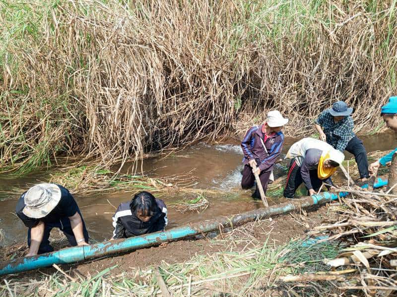 Laying water pipes for drinking water and utility use into the community