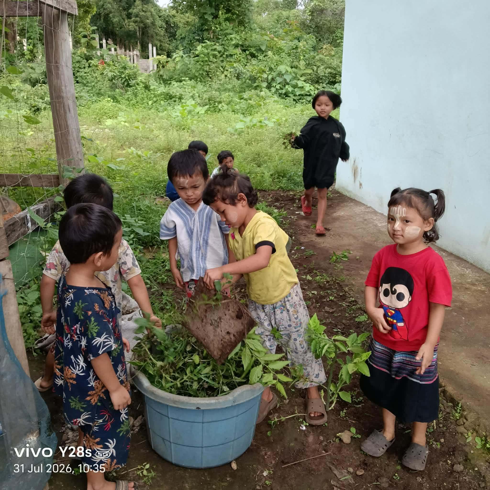 The young children helped remove weeds from the fields..