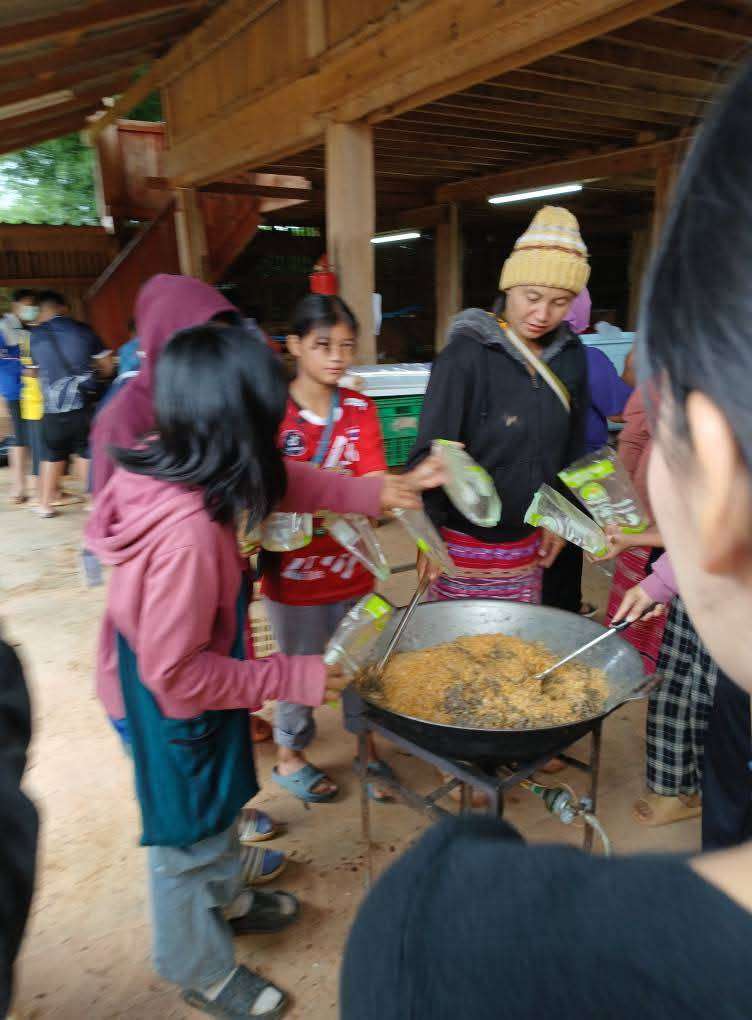The children and their parents are coating bananas and sweet potatoes.