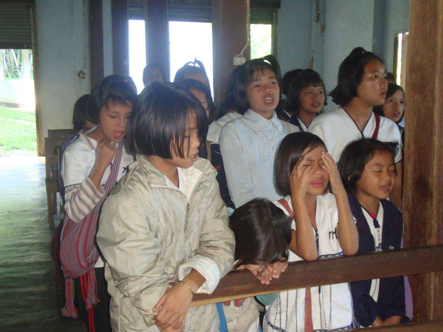 Joining in worship at the dormitory.