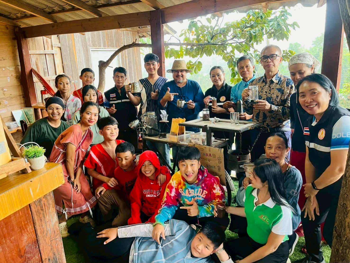 Children learn coffee processing skills with instructors.