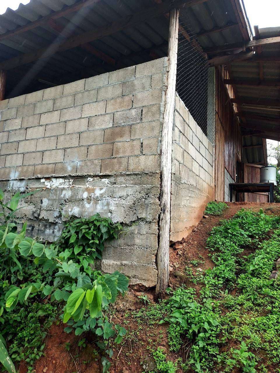 The image shows a structure that has begun to show extensive cracks and is unsafe.