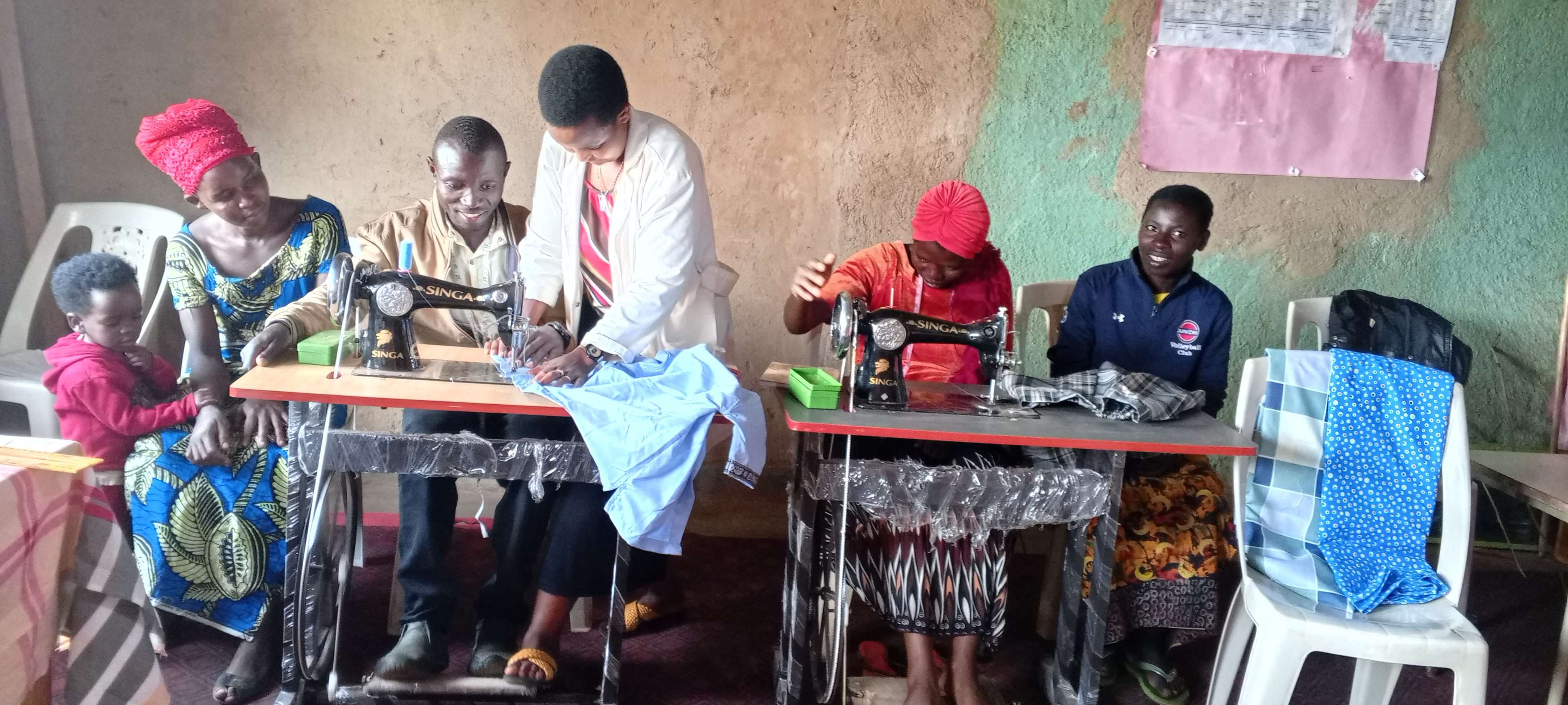 The caregivers are making use of the tailoring skills they have gained. These are 8 out 60 who applied to learn but we do not have the means to support them.