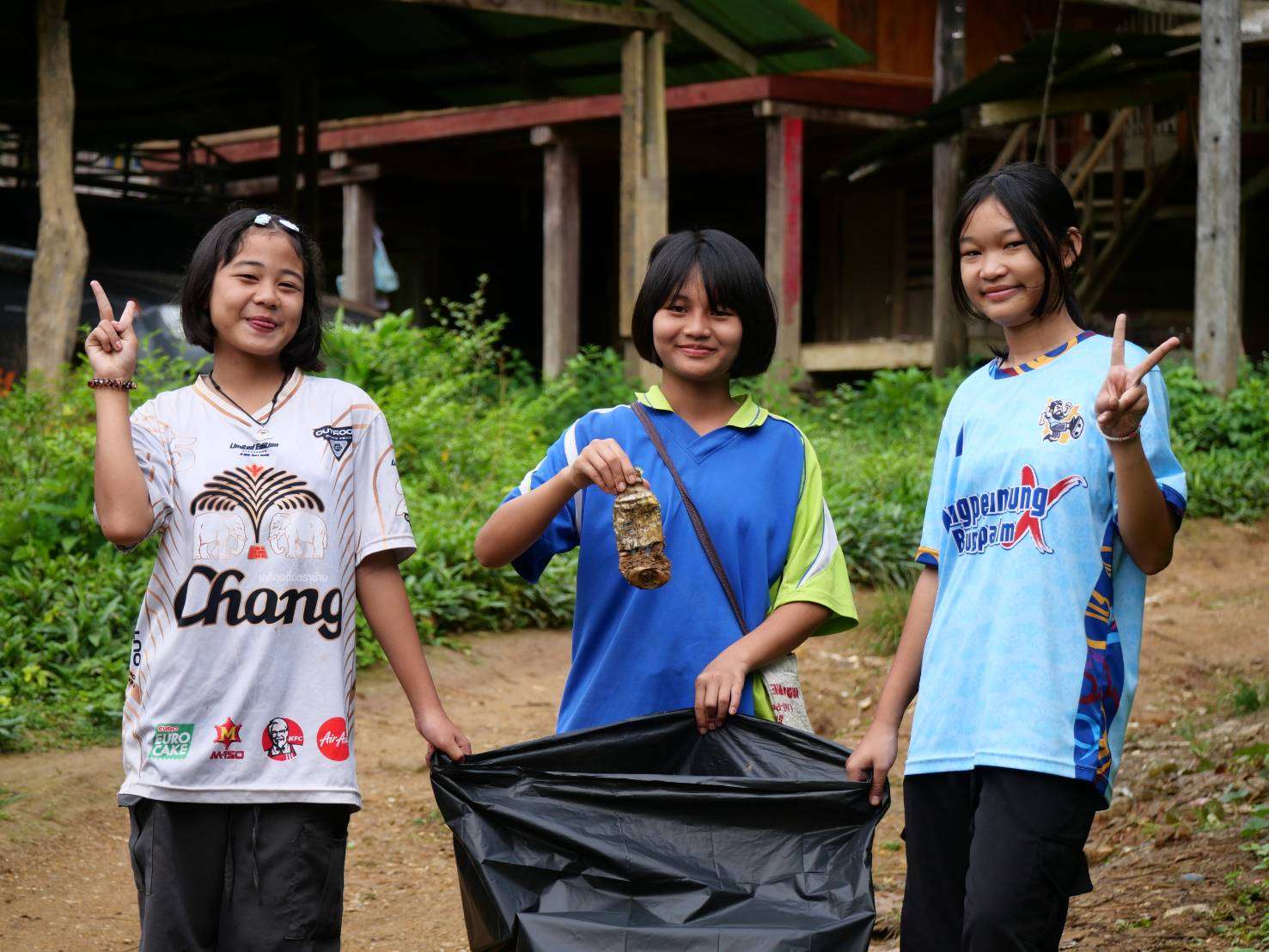 Joining together to collect trash and keep the walkways clean.